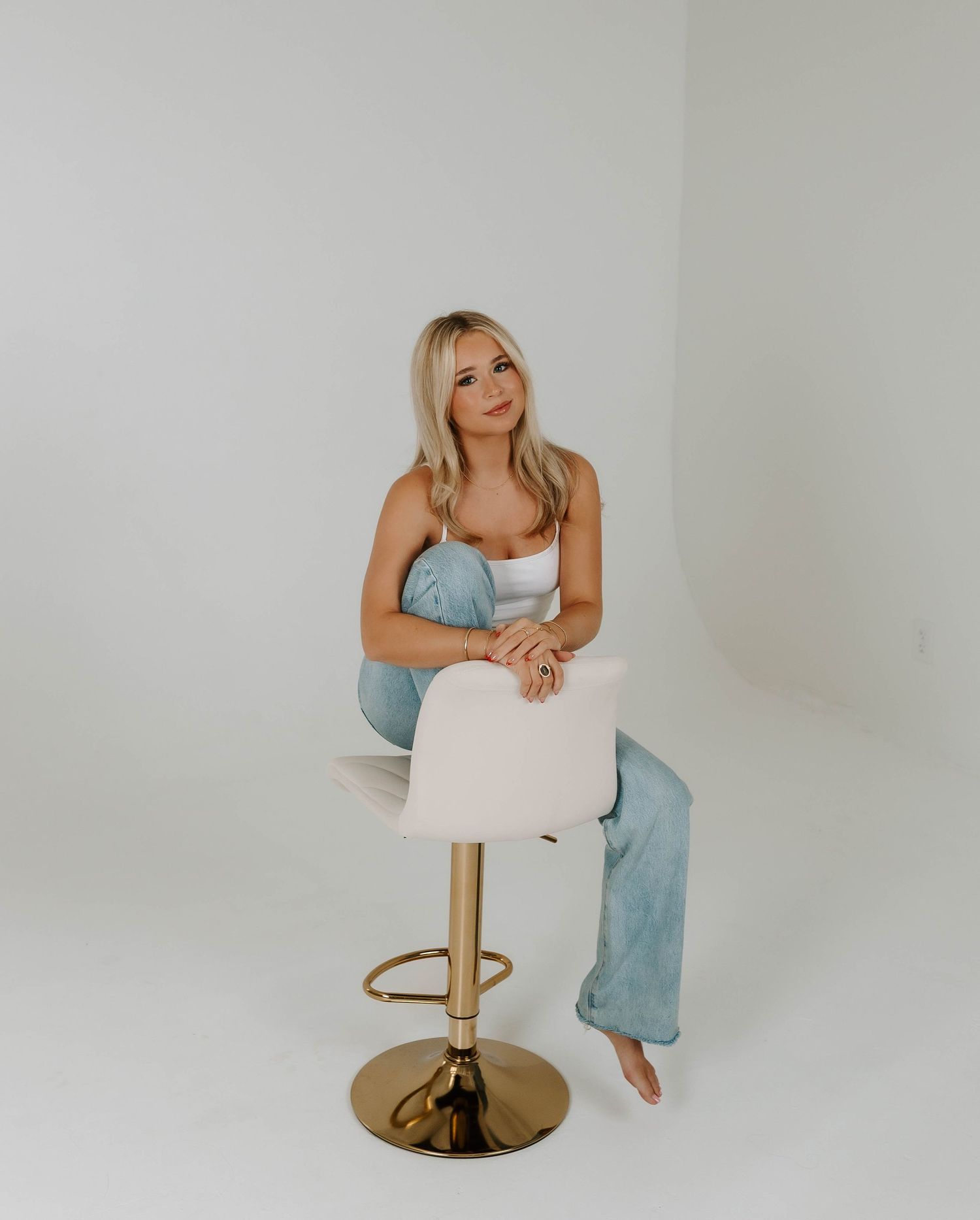 Clean minimalist studio shots showcasing casual contemporary fashion.