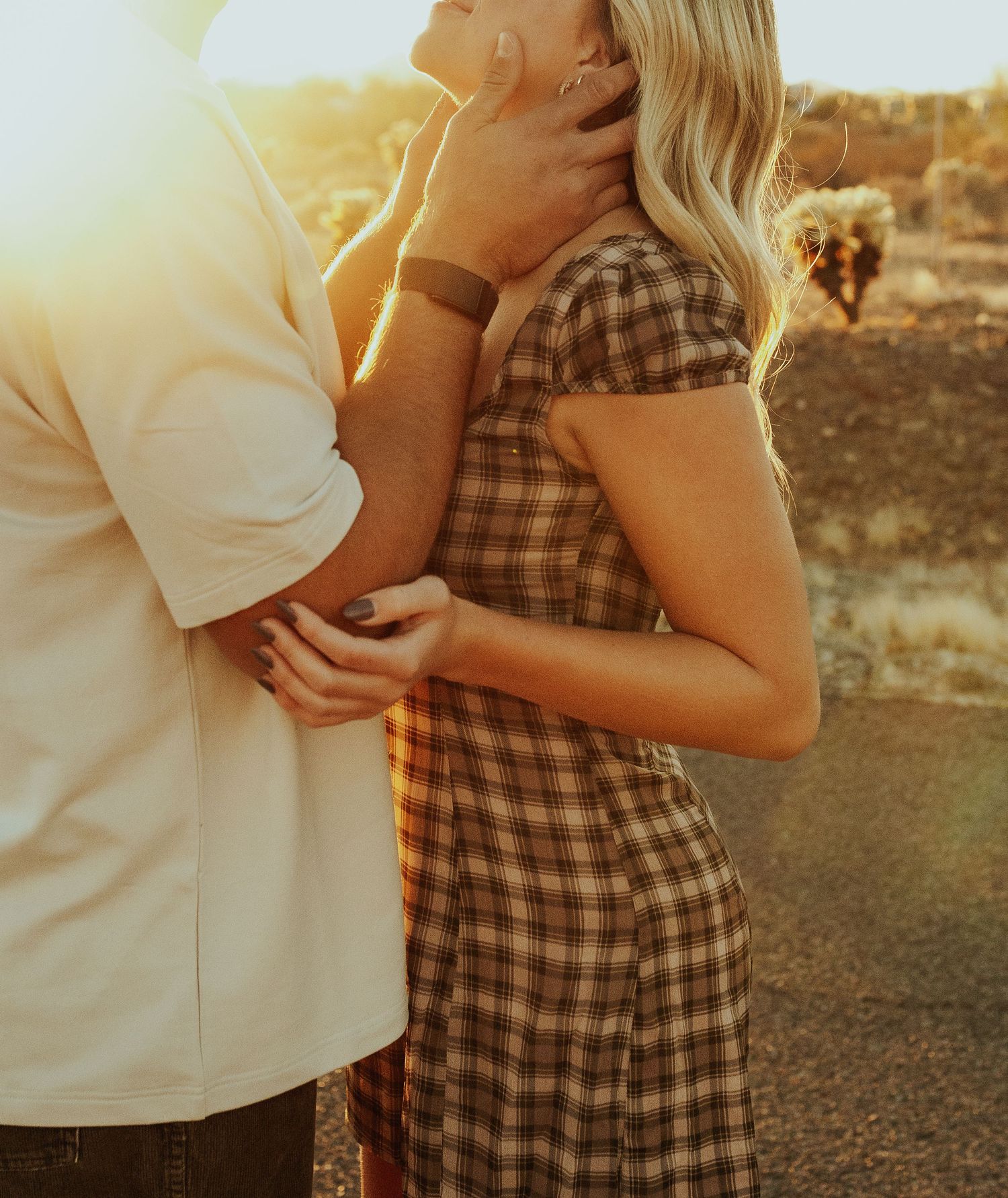 Anthem Arizona Couple Photographer captures Romantic couple embraces golden desert landscape.