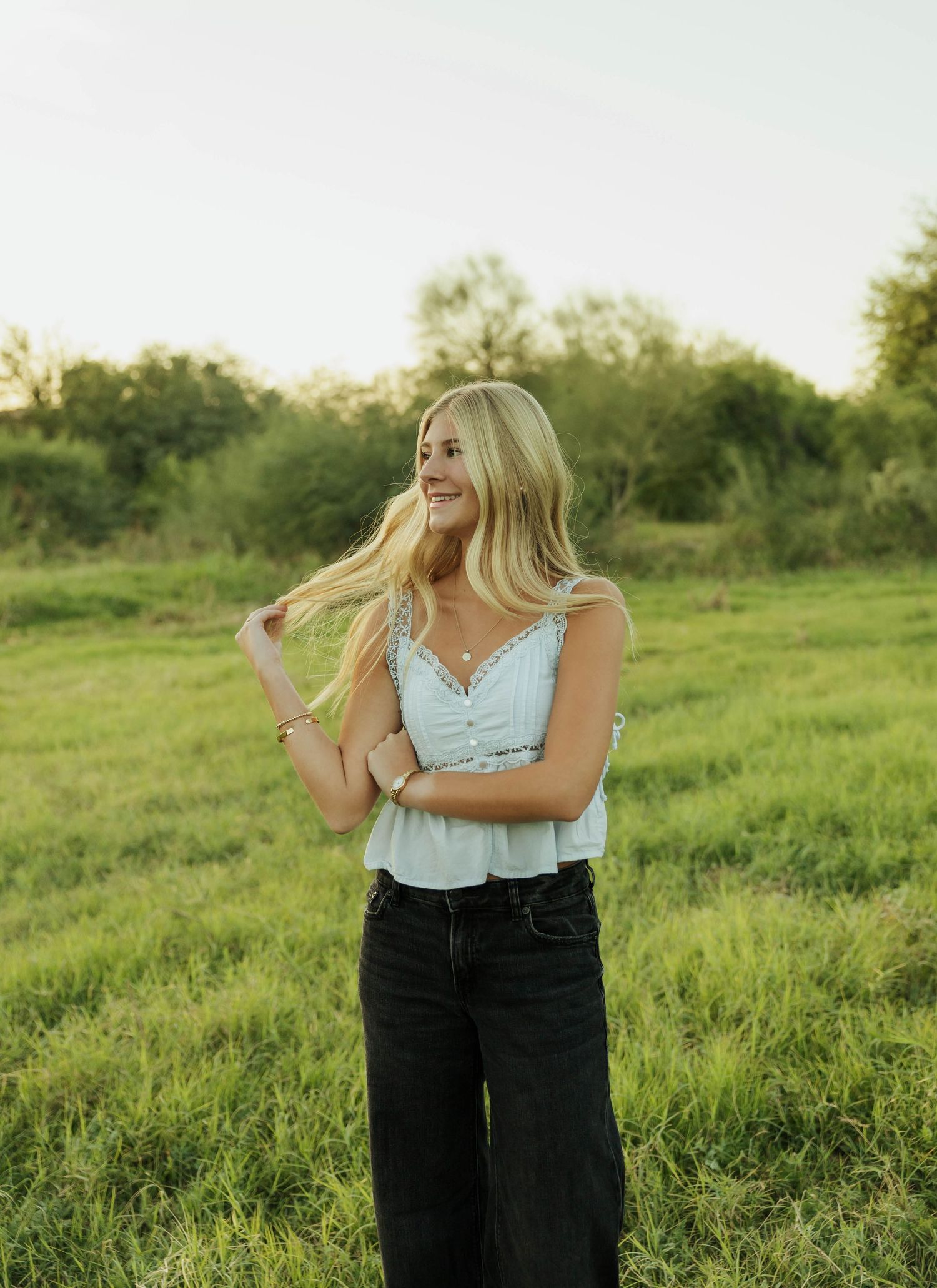 Summer fashion shoot in grassy field. Senior photos