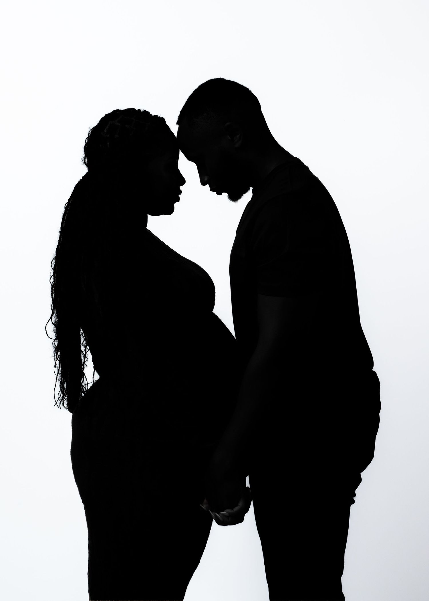 Three silhouetted figures in romantic poses against a white background showing progression of an intimate moment.
