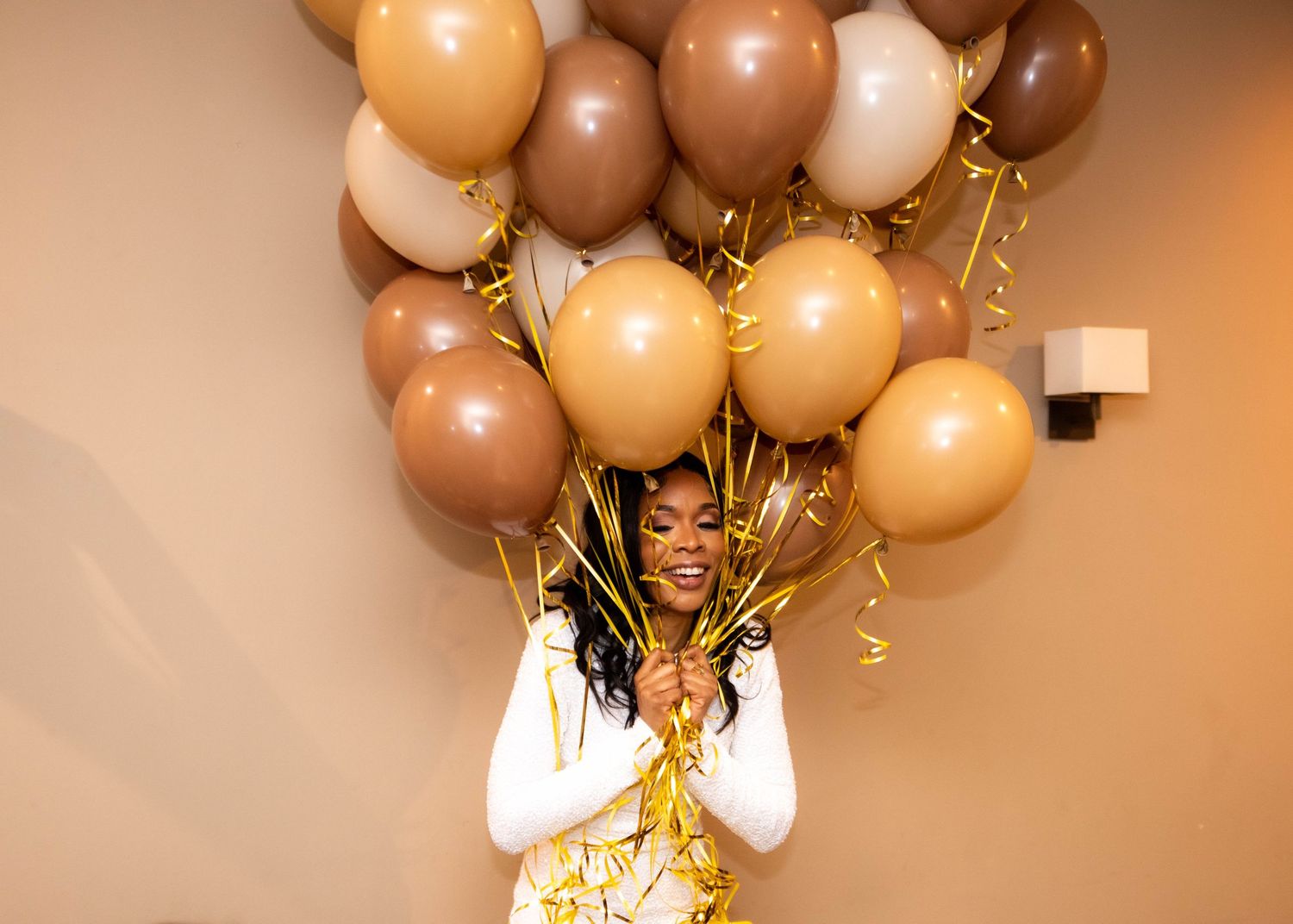 Elegant party decor with brown and gold balloons creating a festive atmosphere.