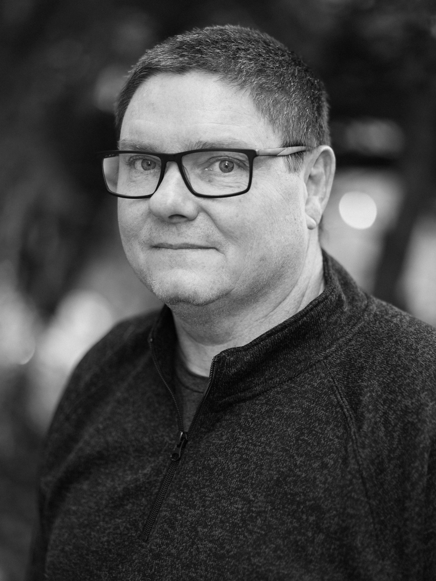 Black and white portrait series showing different facial expressions.
