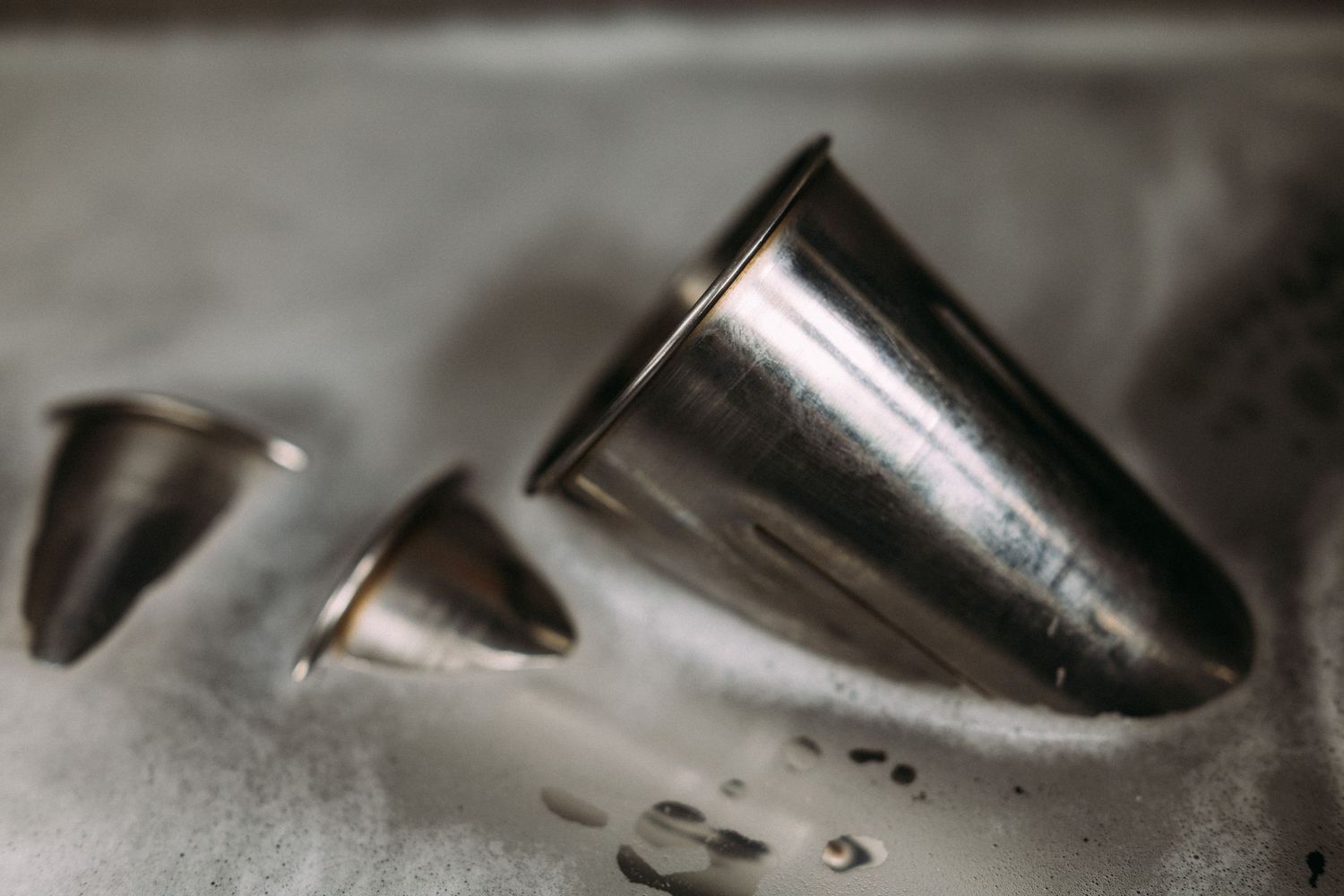 Close-up detail of stainless steel kitchen equipment with metallic textures.