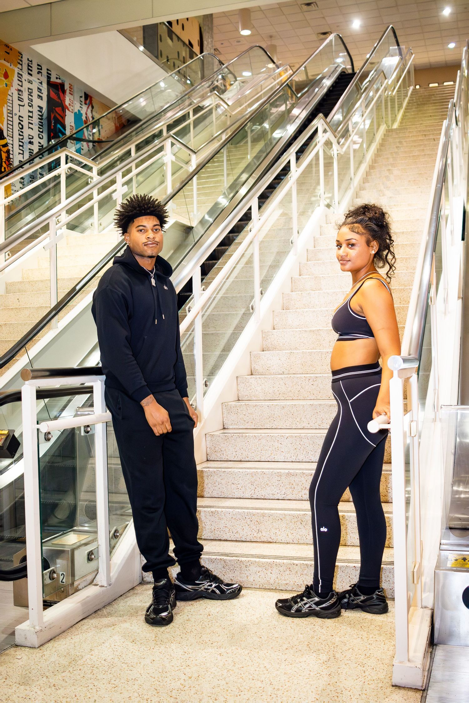 A sequence of photos showing two people interacting on a staircase in what appears to be a commercial building.