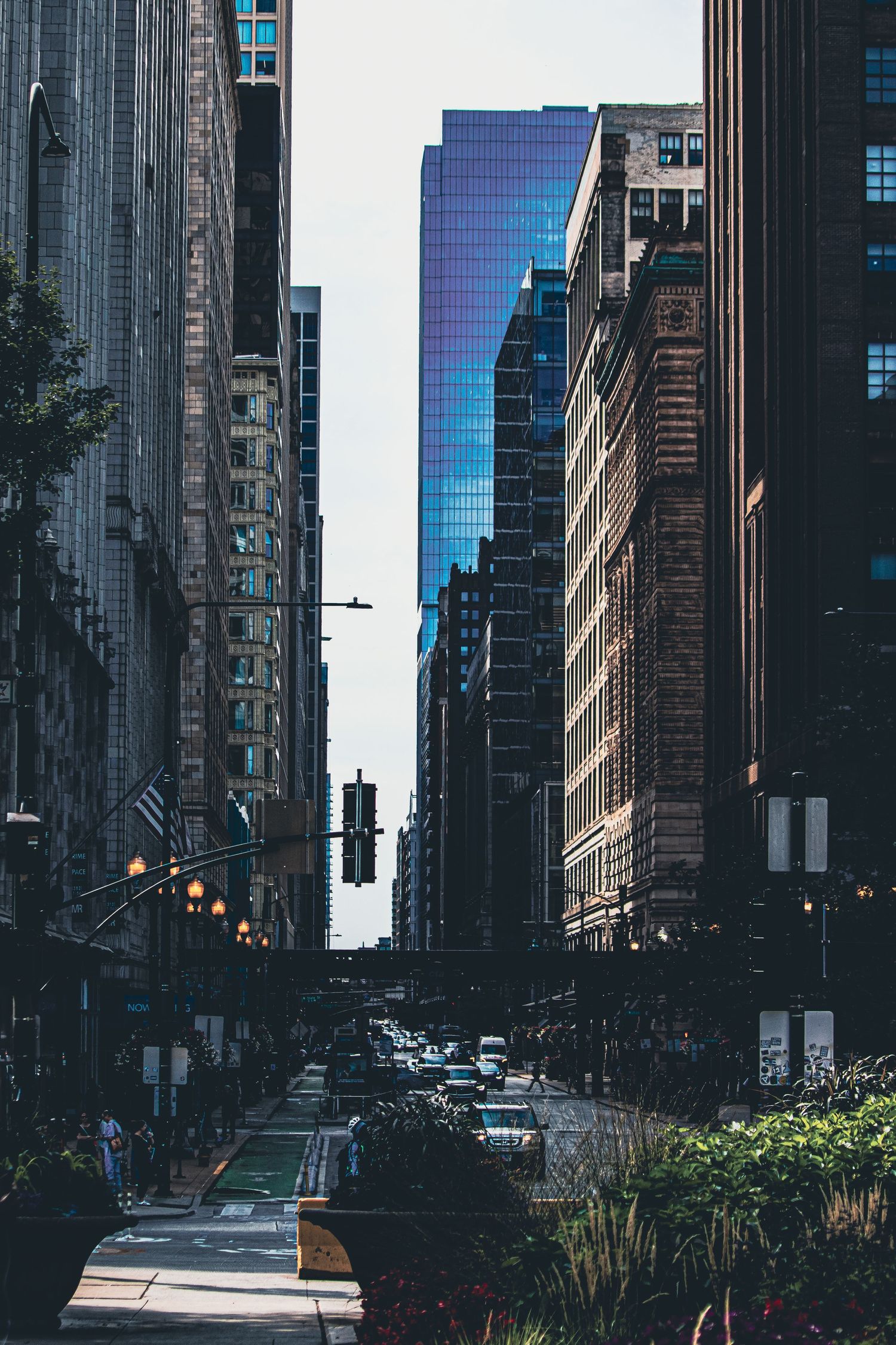 Urban street view of modern glass buildings and skyscrapers in downtown Chicago.