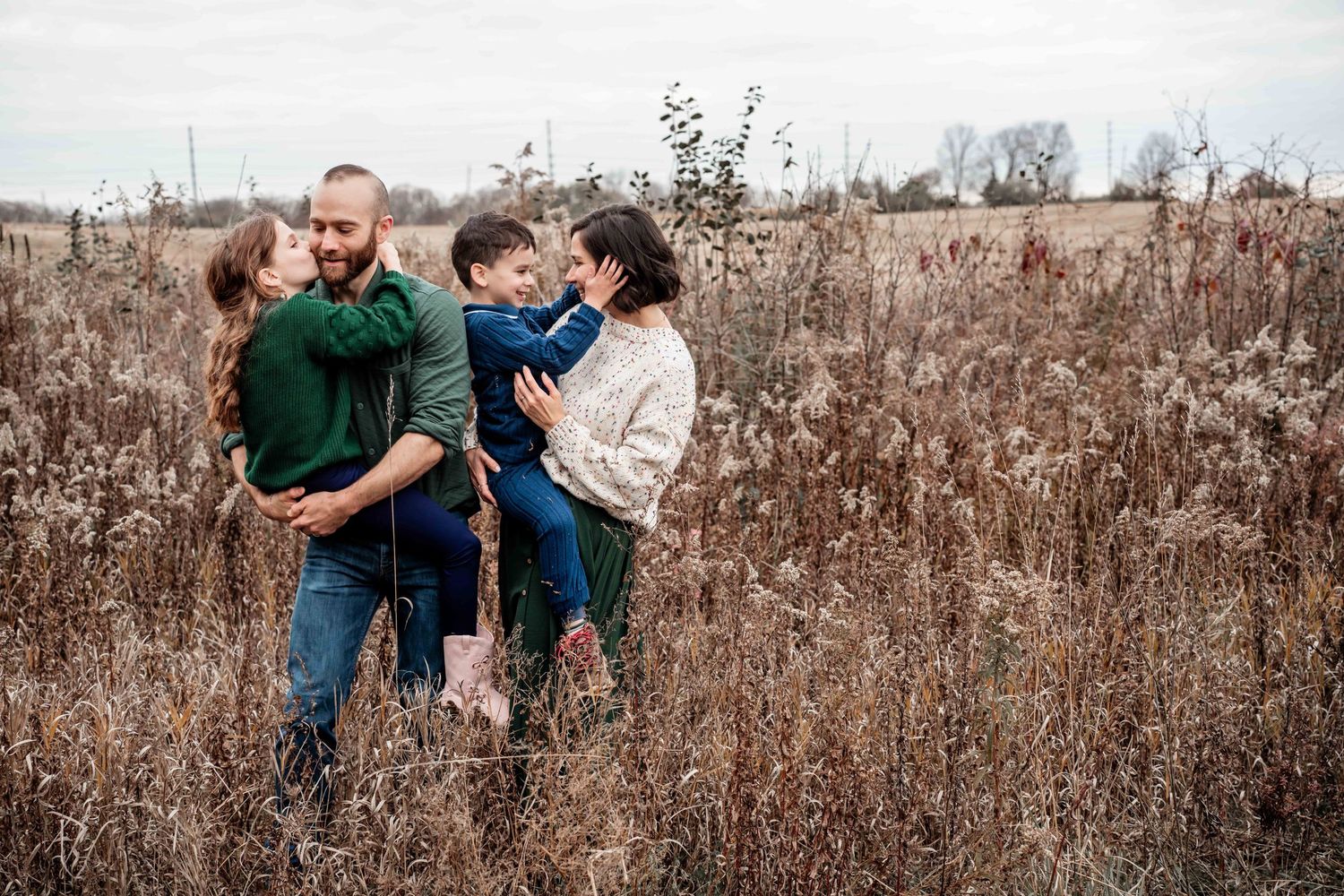 A series of candid family moments captured in a rustic autumn field with tall brown grass and natural lighting.