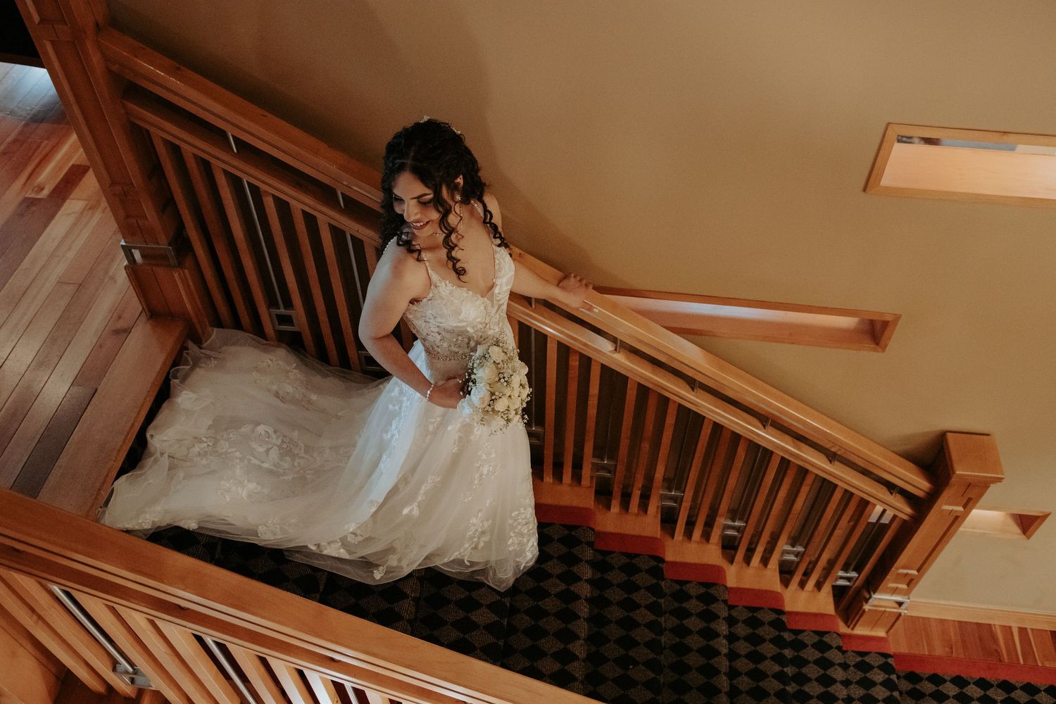 Elegant bride walking down the staircase at Raheen Woods Hotel in Athenry, Galway, moments before her wedding ceremony