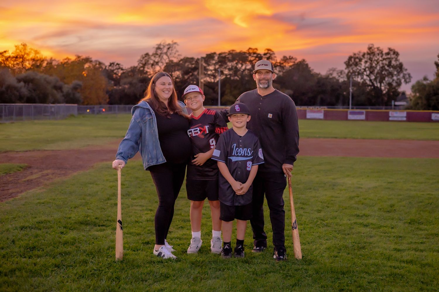 Local Family pose with expectant mother and beautiful sunset in baseball photo shoot in Santa rosa by Sonoma county photographer smc shots