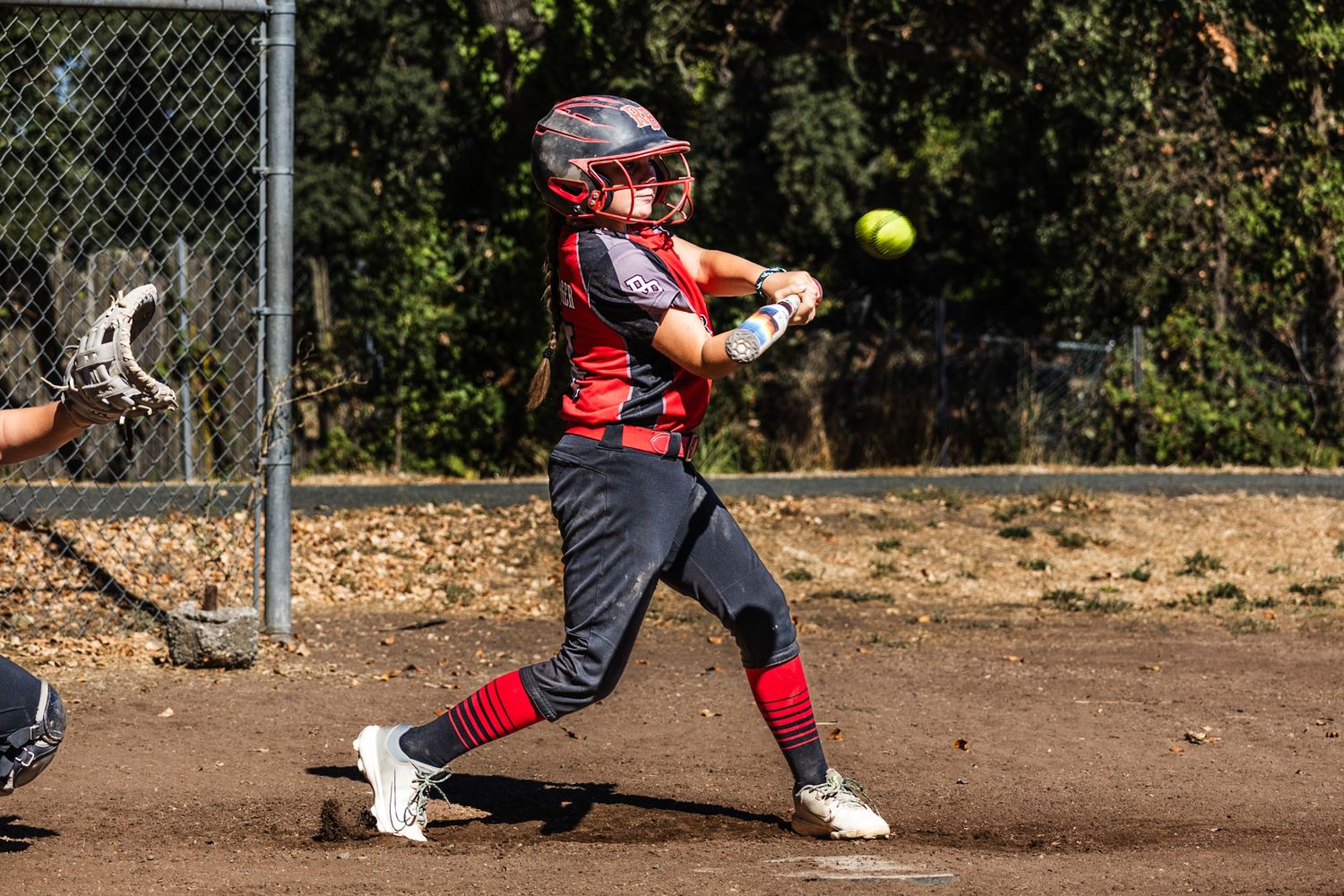Ball in the air in Softball girls action sports photography Sonoma county by SMC shots