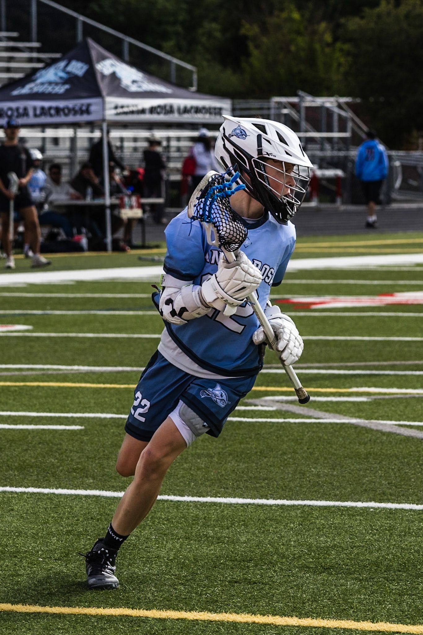 Felix running in lacrosse game image by smc shots