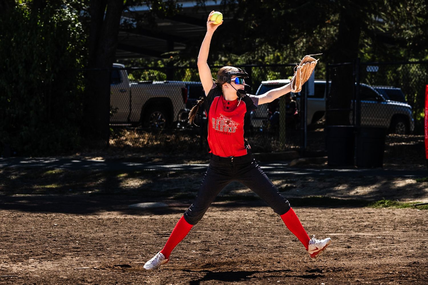 Softball girl throwing a ball action sports photography Sonoma county by SMC shots