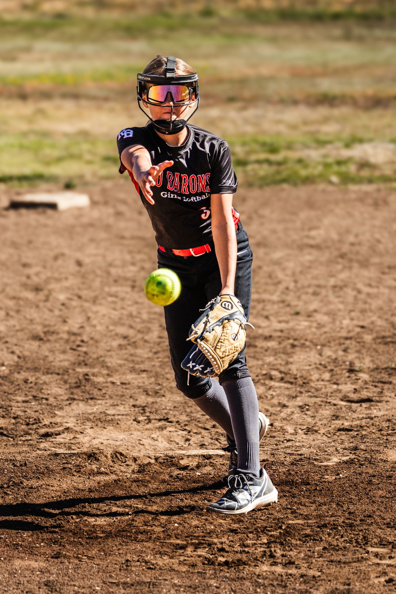 Ball in the air in Softball girls action sports photography Sonoma county by SMC shots