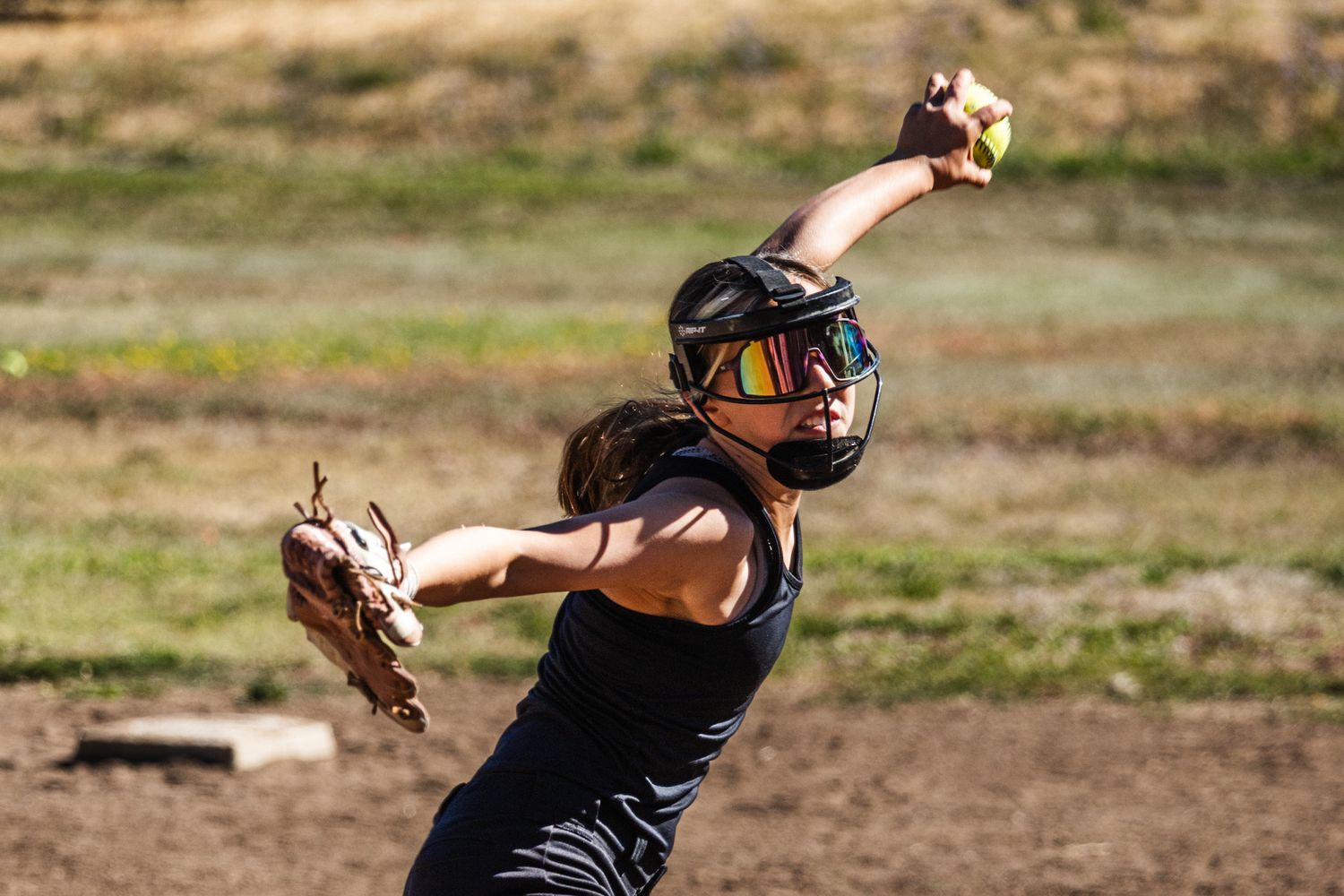 Softball player throwin at school in Santa Rosa image by smc shots