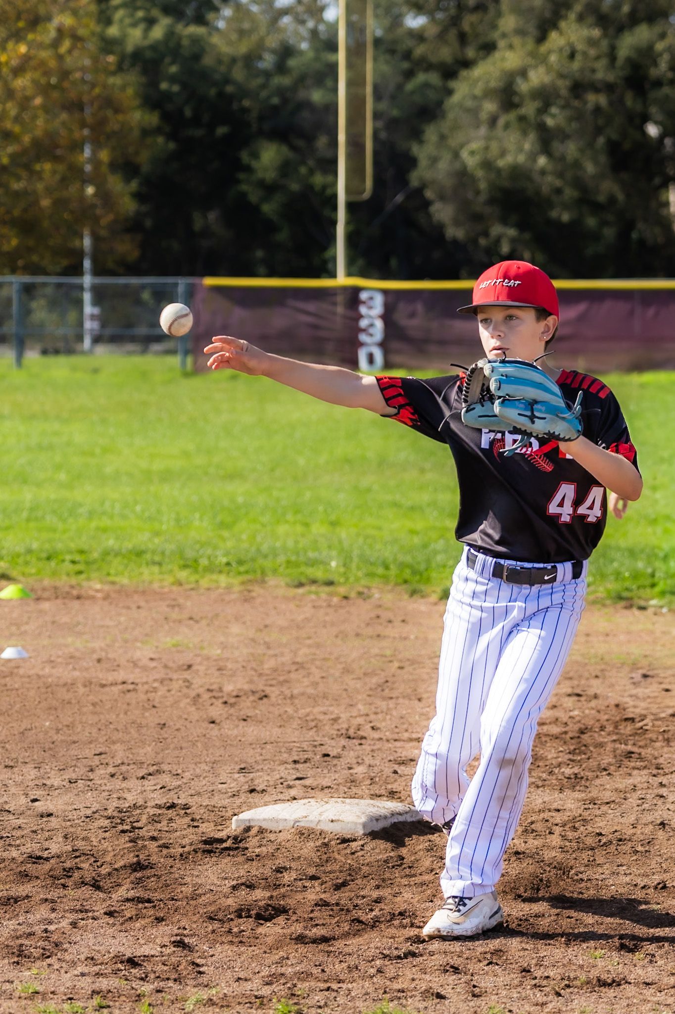 baseball pitcher throws fast ball in Santa rosa, California in sports phot by smc shots of sonoma county