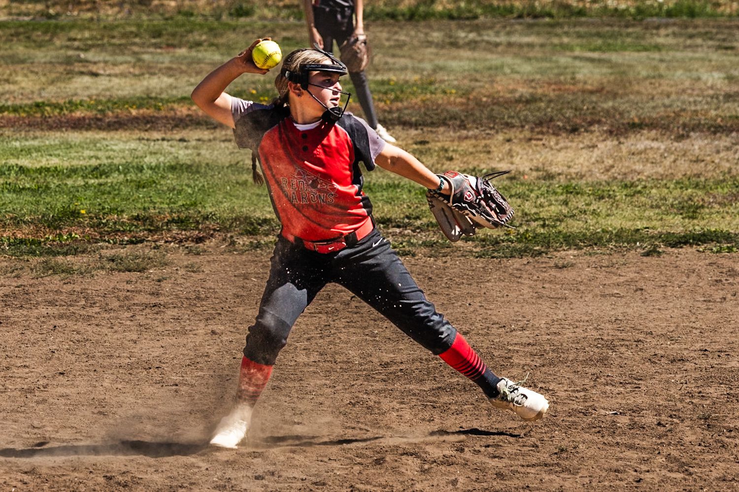 Softball girl leg kicks in action sports photography Sonoma county by SMC shots