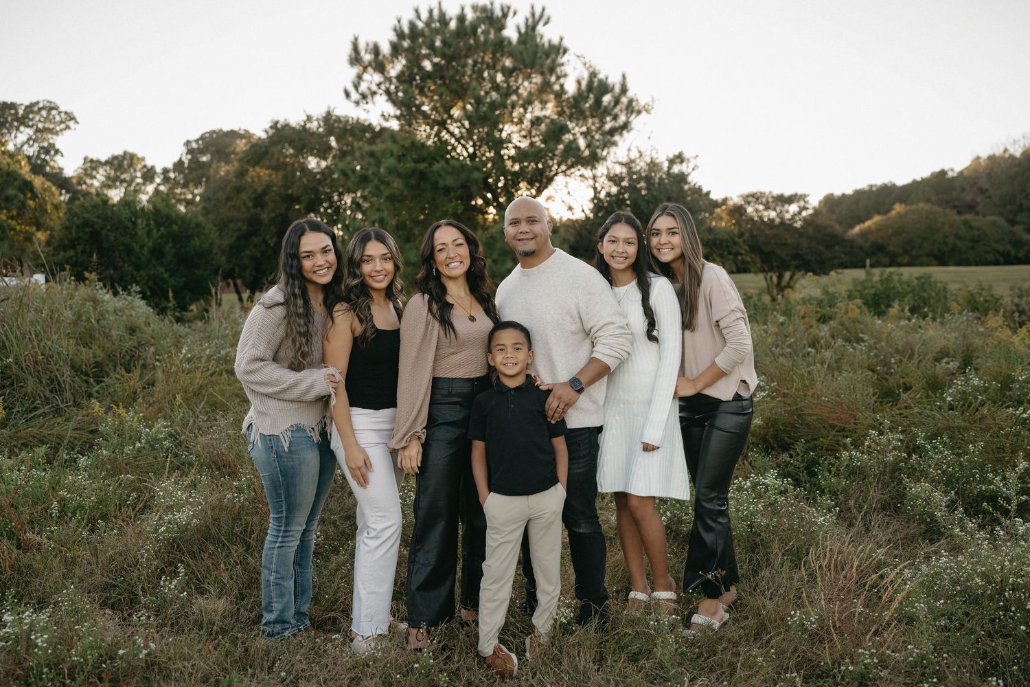 Family portraits at Dix Park Raleigh NC with natural light and greenery