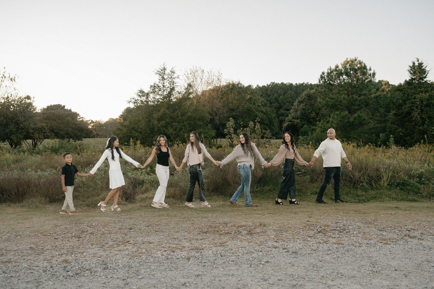 Family walking at dix park garden during a mini session.