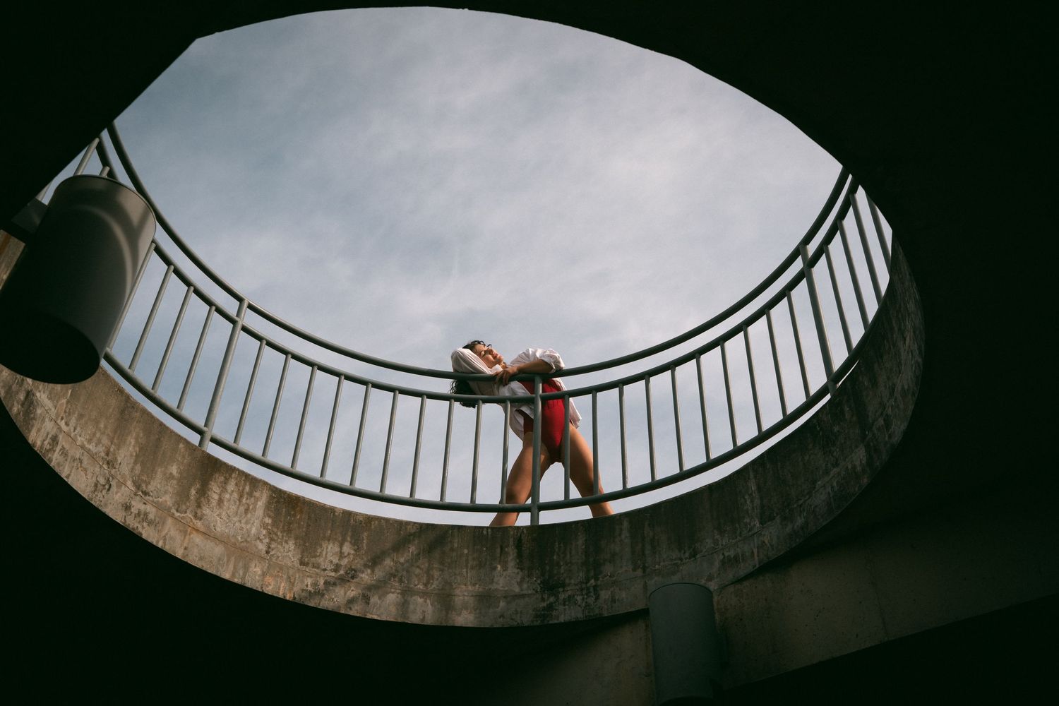 High school senior dancer in red leotard at JC Raulston Arboretum in Raleigh
