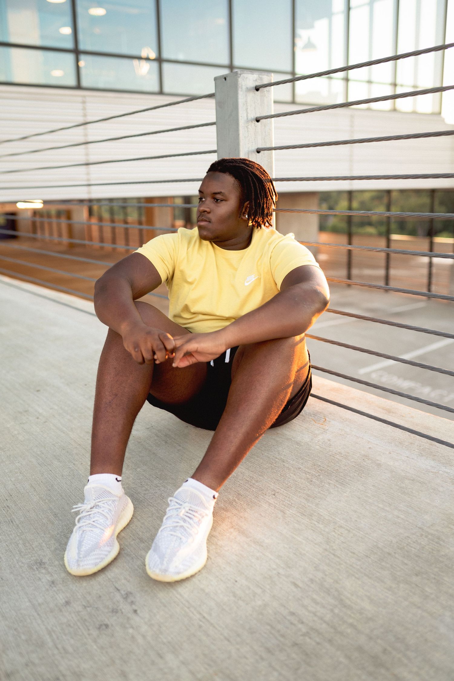 High school senior boy portrait in Raleigh’s warehouse district urban setting