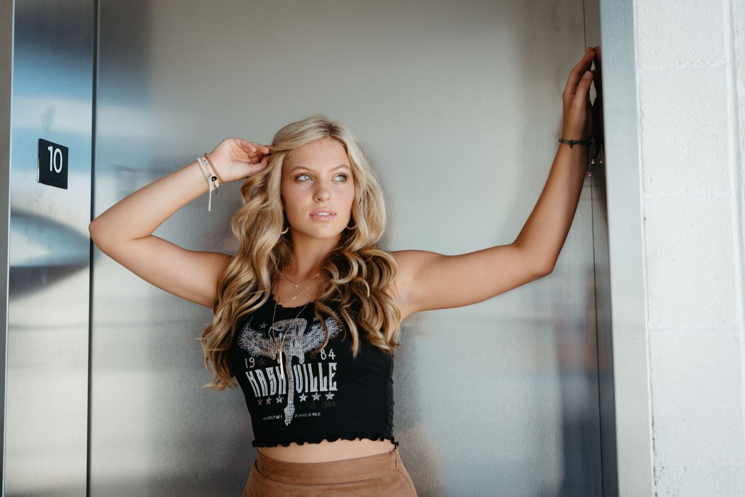 downtown-raleigh-parking-deck-senior-girl-western-outfit.jpg