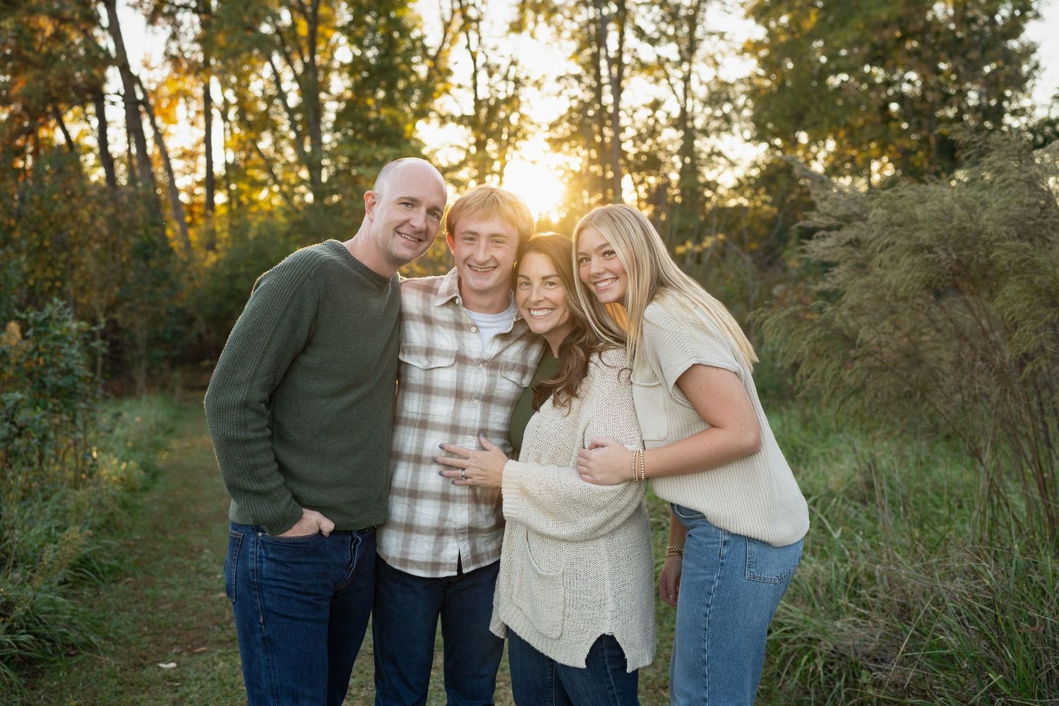 Family portrait session outdoors at Sugg Farm in Holly Springs NC