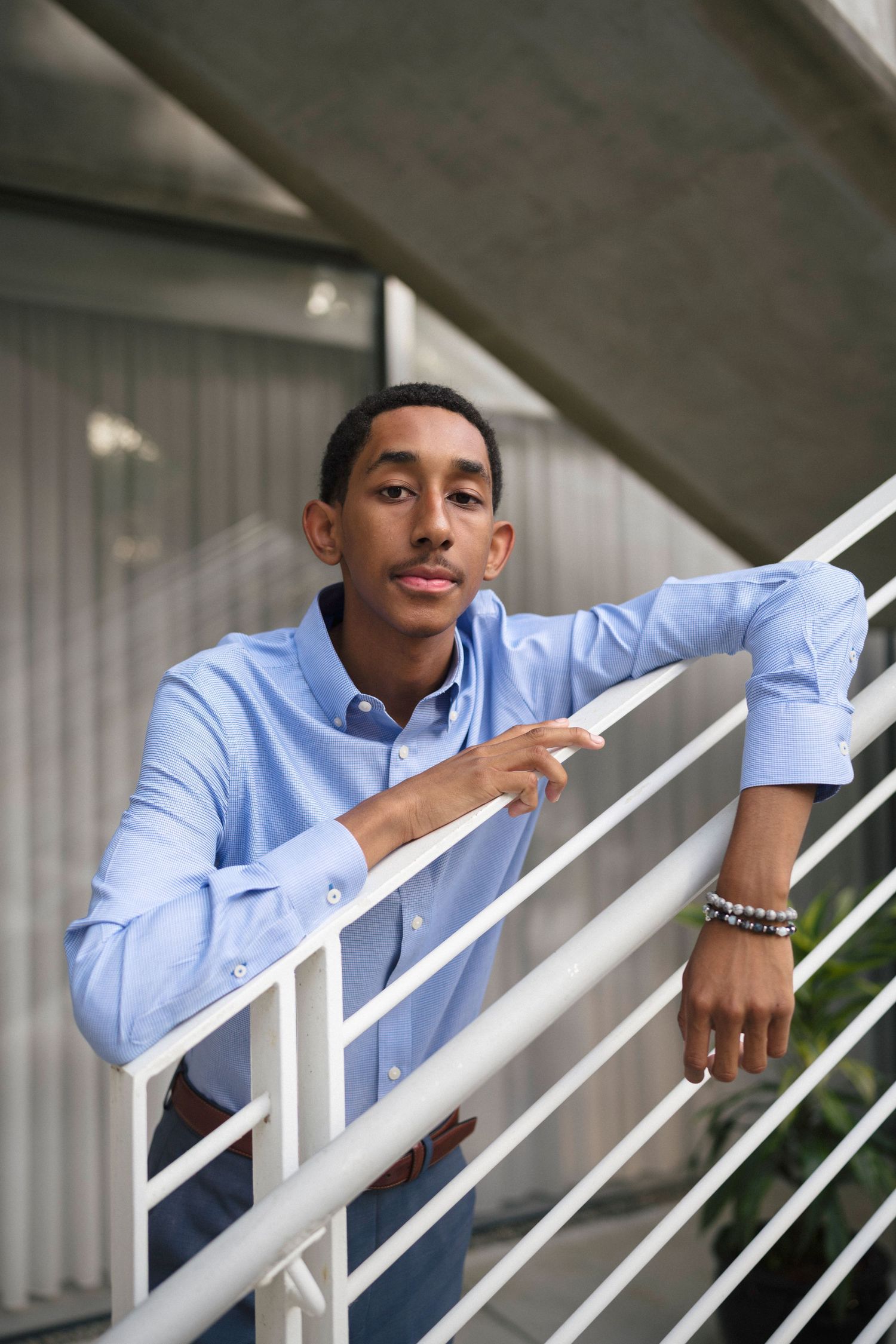 Serious high school senior portrait at WRAL Azalea Garden in Raleigh