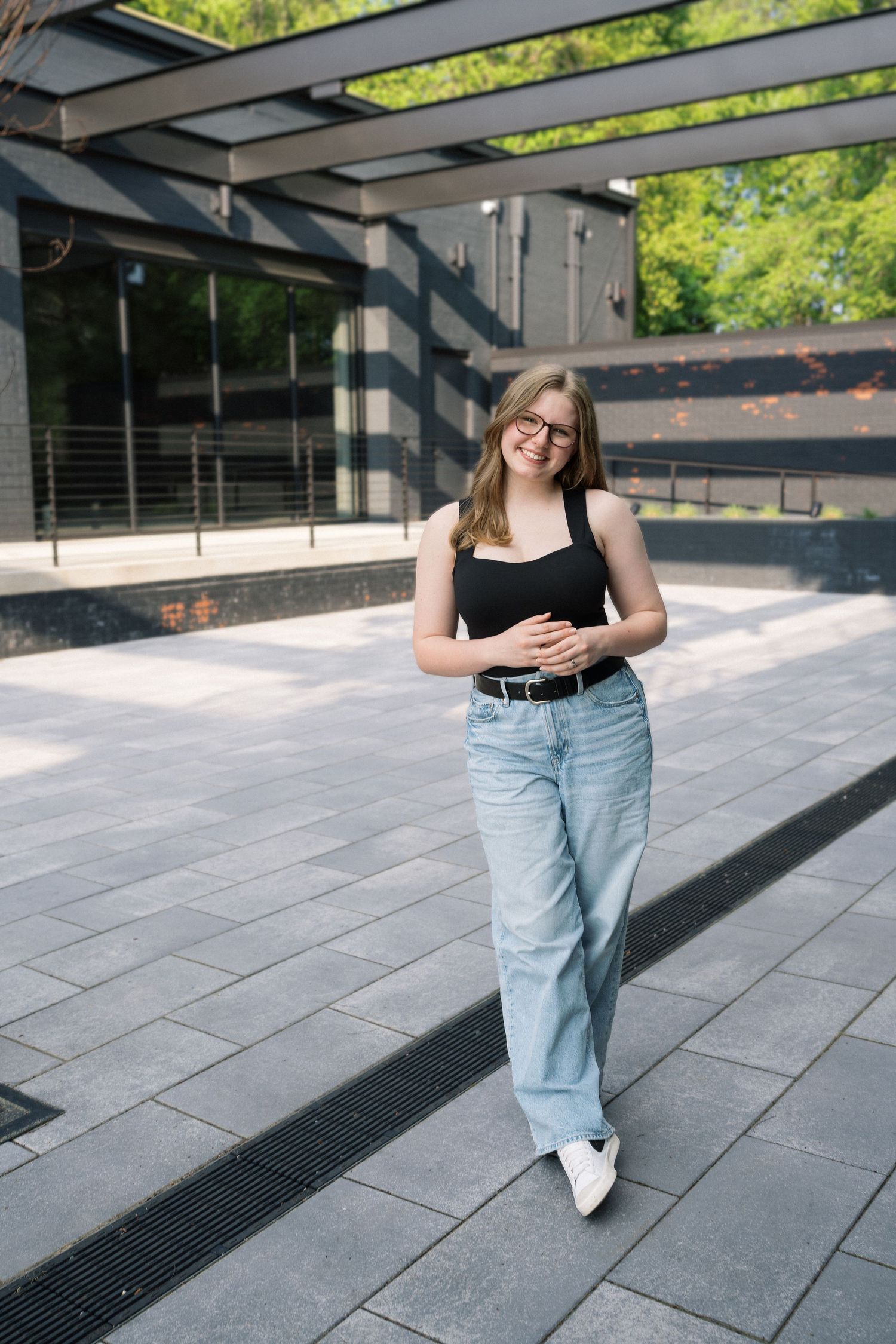 High school senior girl posing outdoors during her senior photo session in Raleigh, North Carolina.