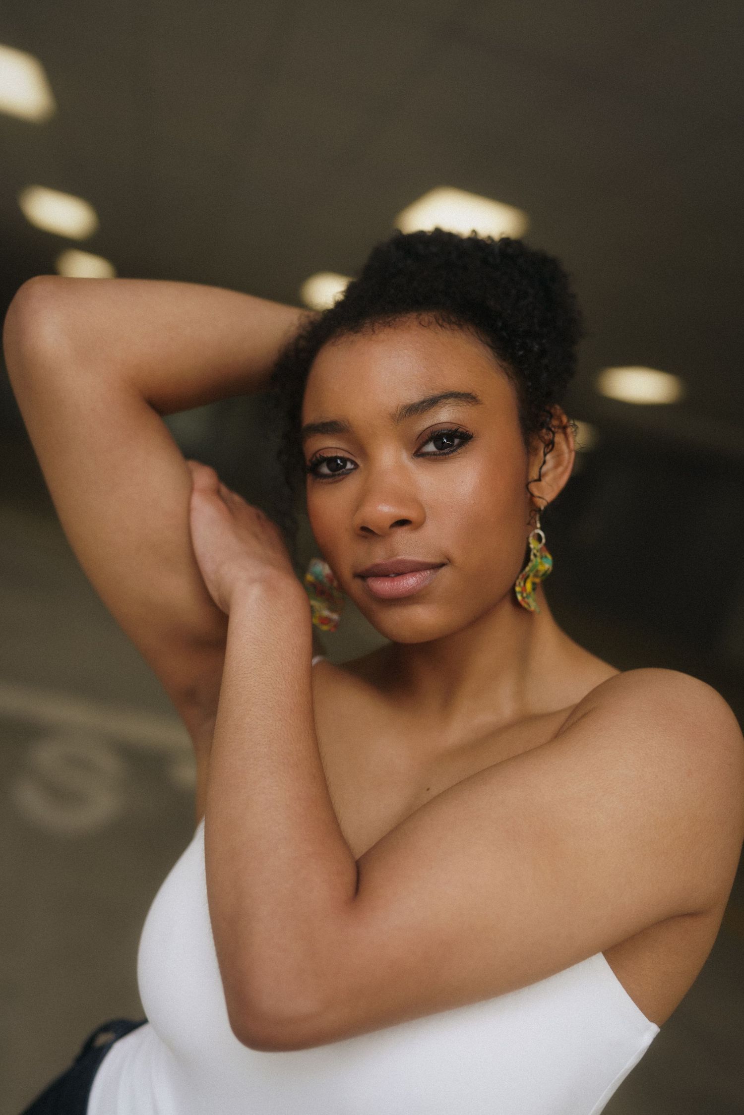 Close-up of a high school senior girl at a parking deck in downtown Raleigh, North Carolina.