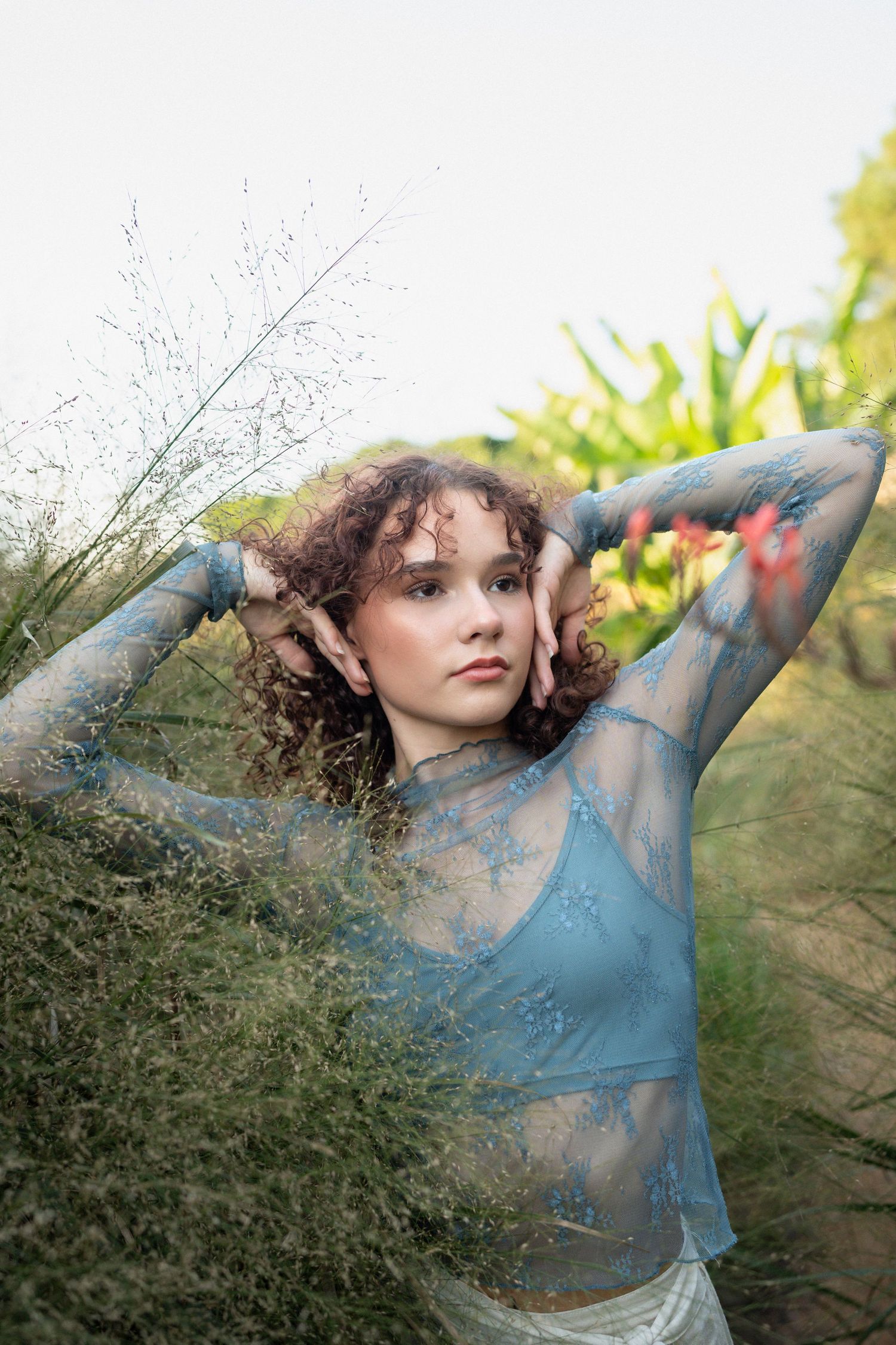 High school senior dancer posing outdoors at JC Raulston Arboretum in Raleigh, North Carolina.