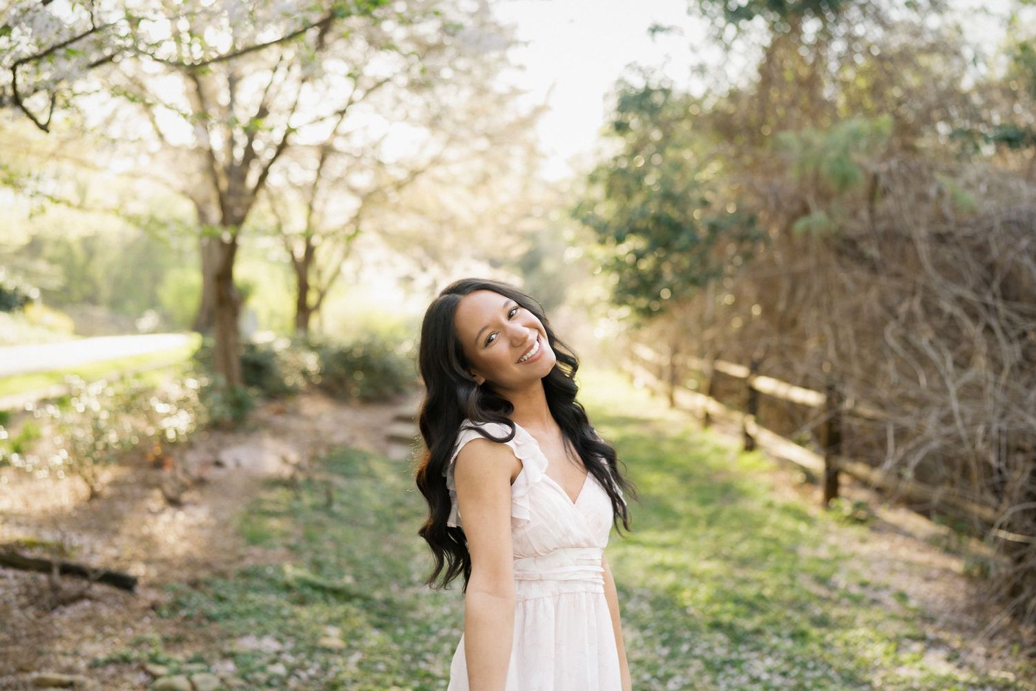 High school senior girl portrait with cherry blossoms in Raleigh North Carolina