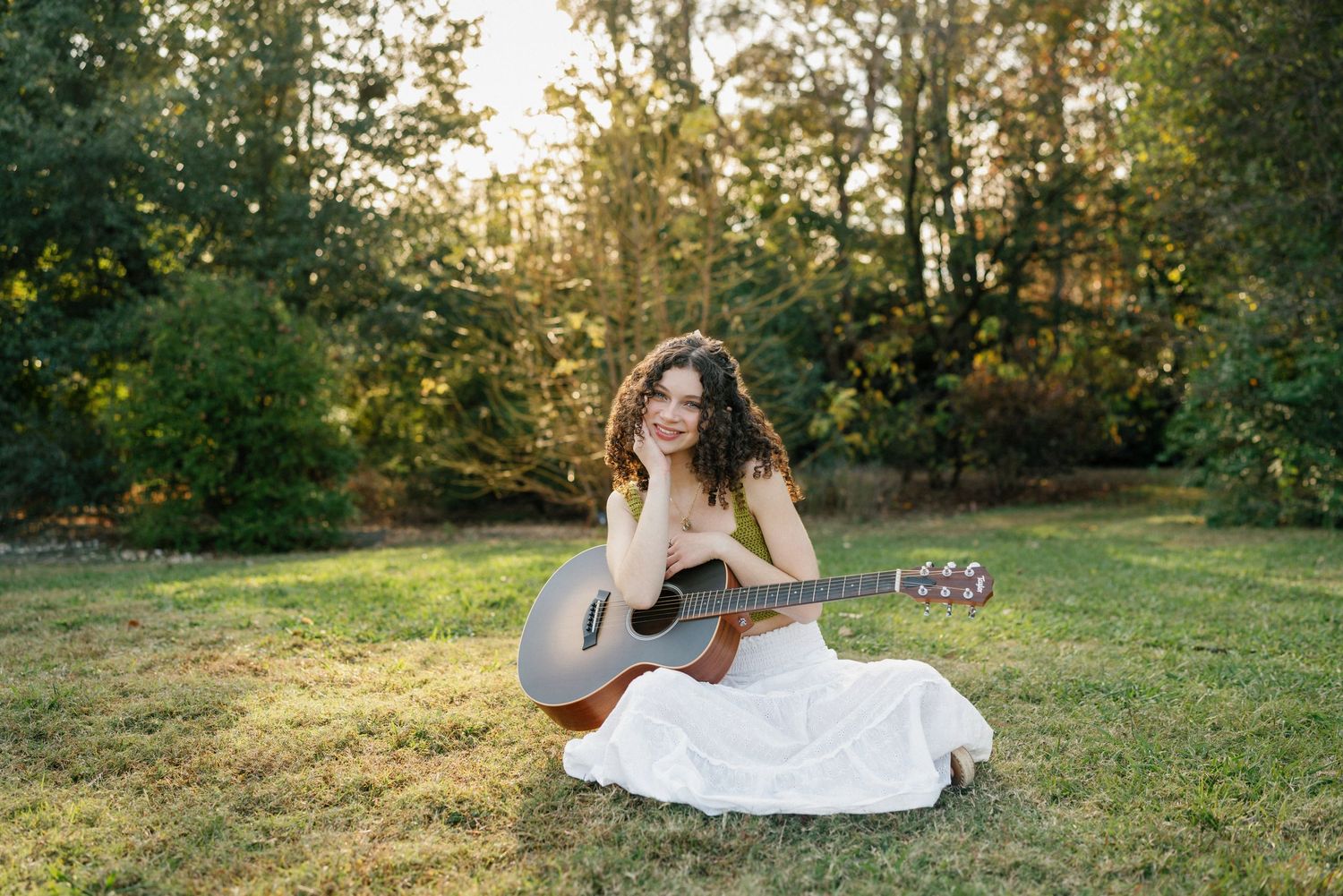 High school senior girl with guitar at JC Raulston Arboretum in Raleigh, NC