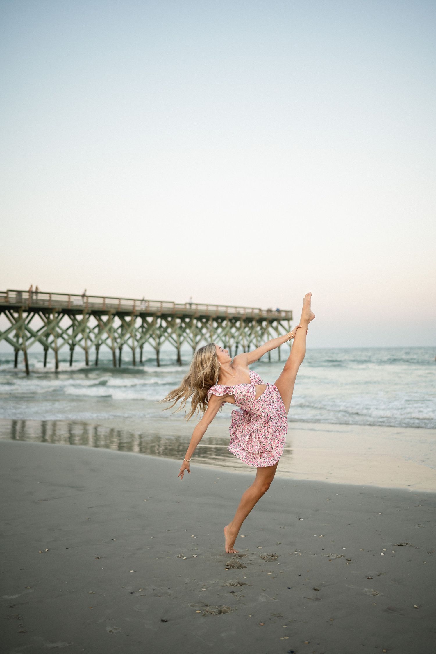 Sydney dancing on Wilmington, NC beach, senior photo session with the ocean in the background