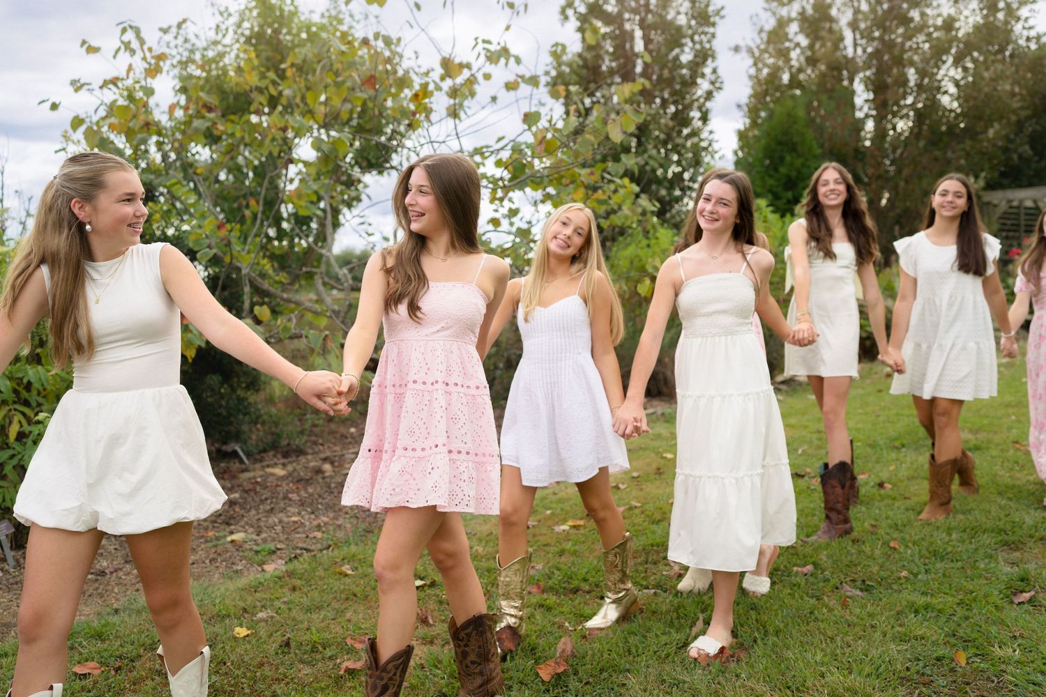 Teenage girls running together during a birthday photo session
