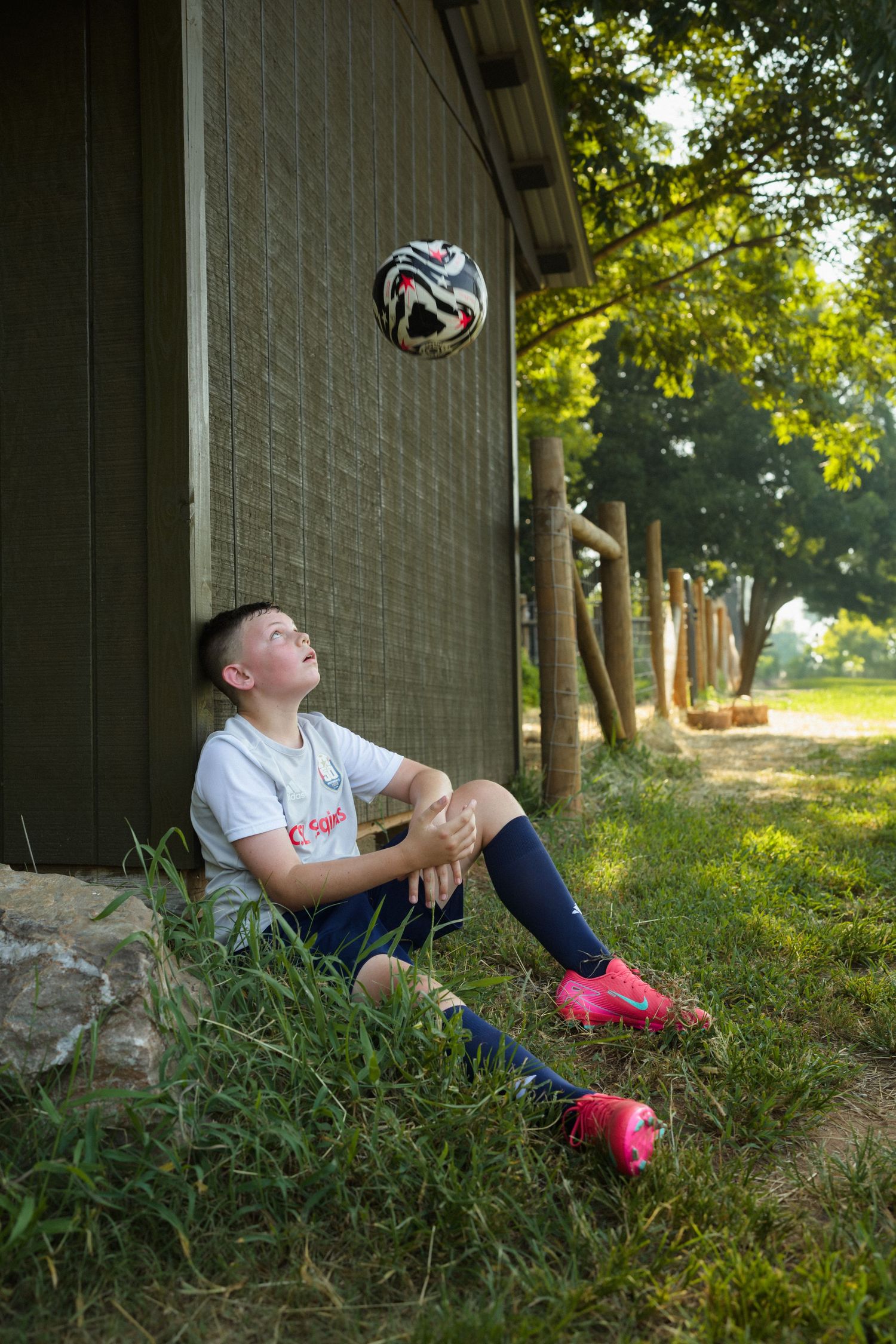 Portrait of a soccer player holding ball in Raleigh NC