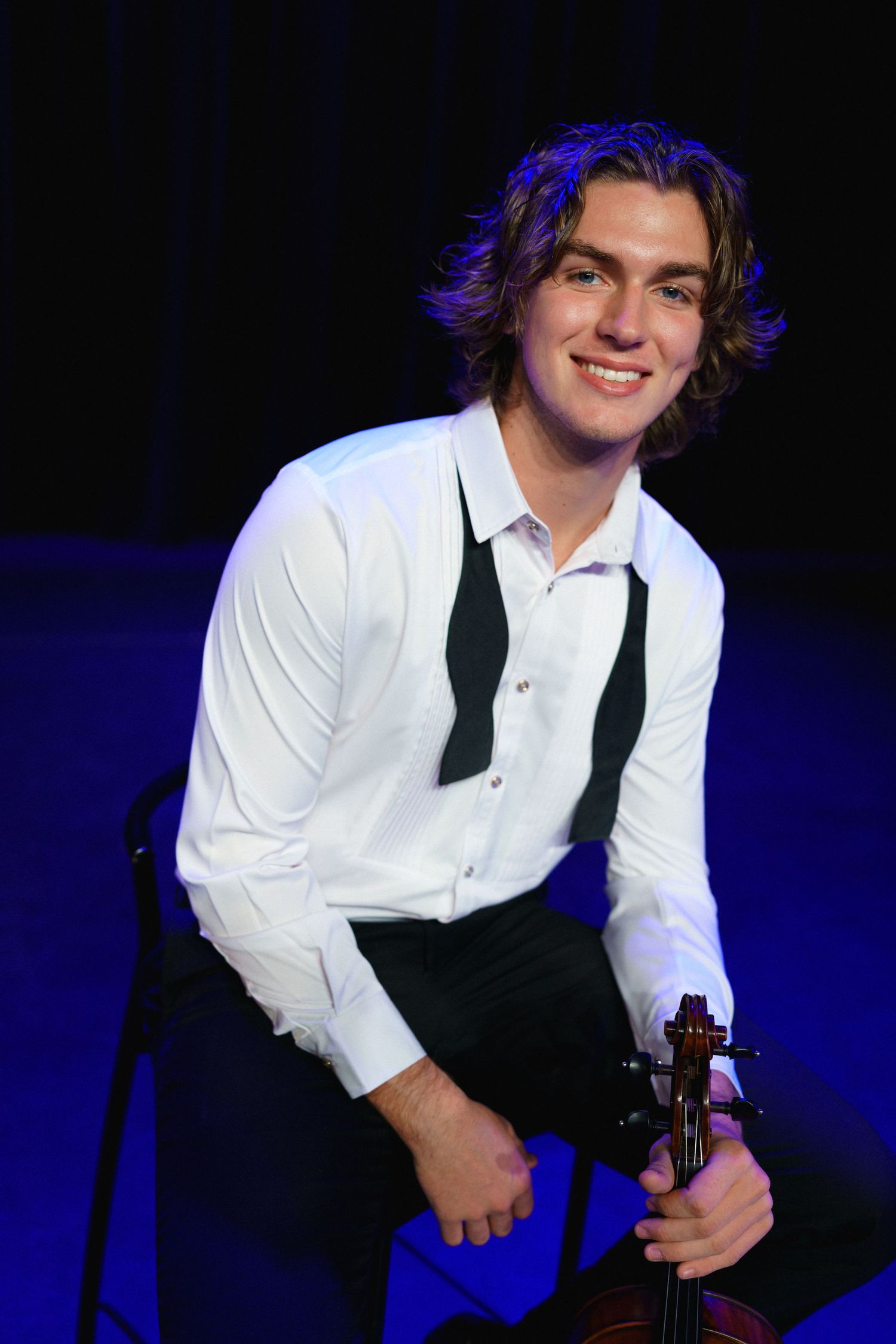High school senior violin performance portrait on stage in downtown Clayton, North Carolina