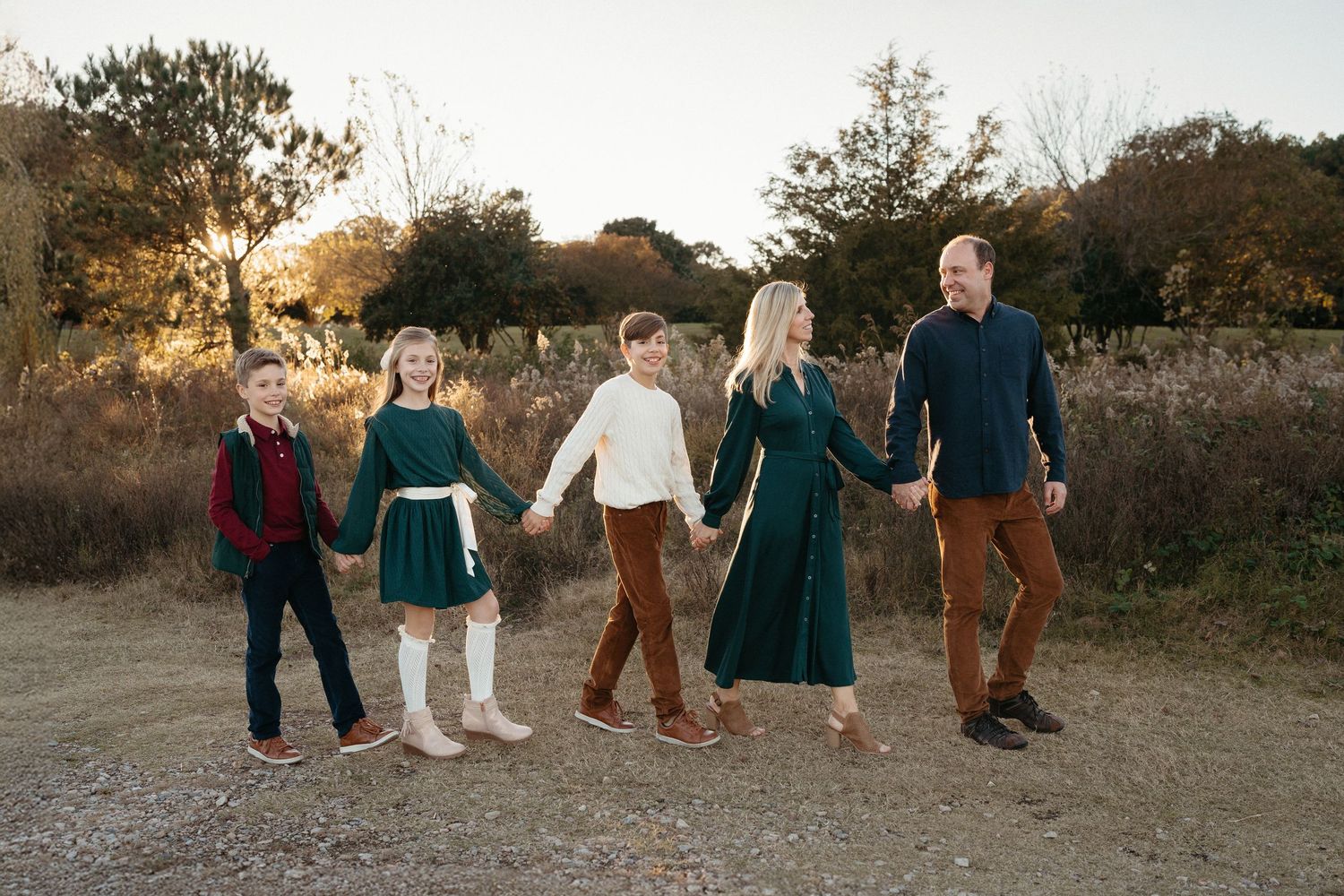 Family portraits at Dix Park Raleigh NC with natural light and greenery
