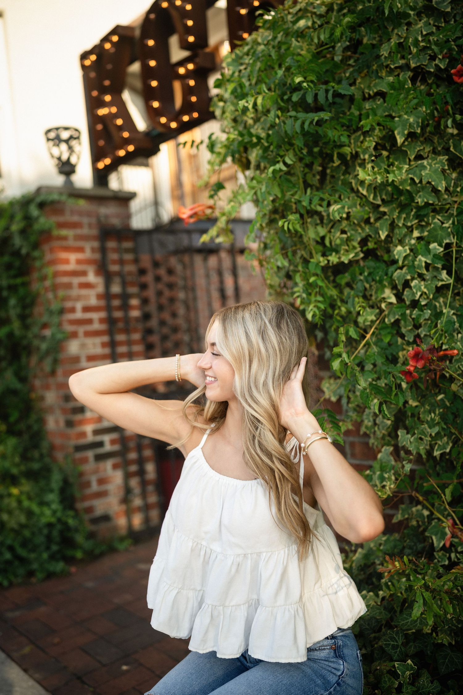Sydney's senior photo session at KGB ILM in downtown Wilmington, NC, blending urban style with historic charm
