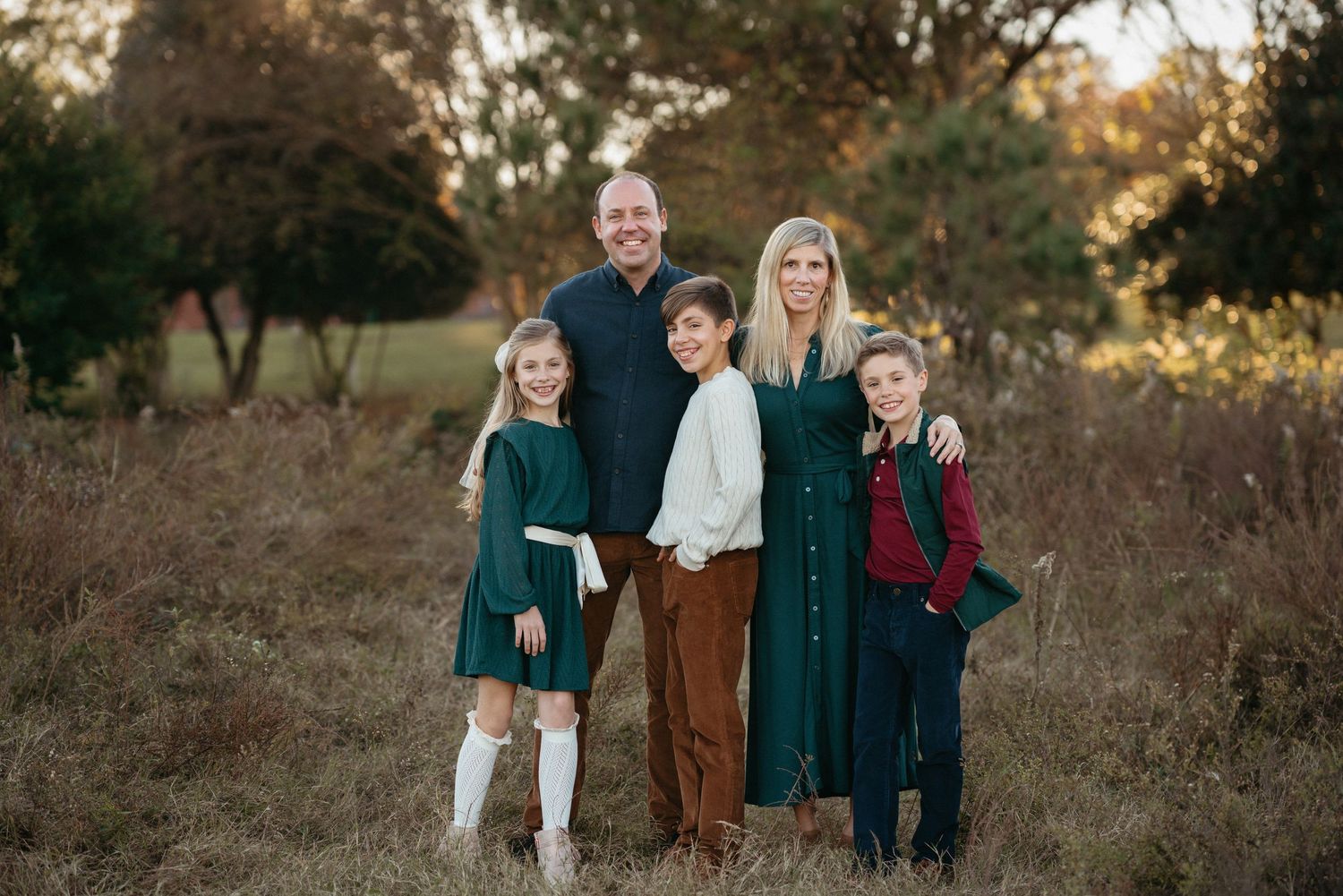 Family portraits at Dix Park Raleigh NC with natural light and greenery