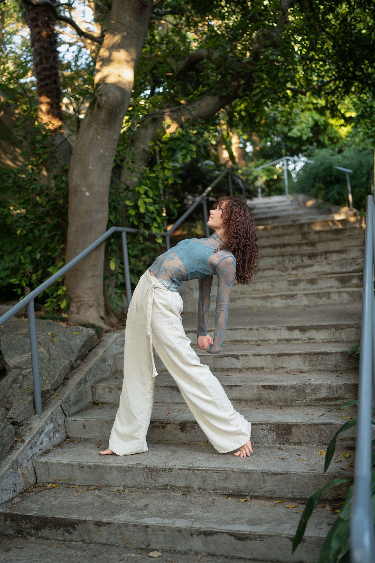 High school senior dancer in motion during her session at JC Raulston Arboretum in Raleigh.