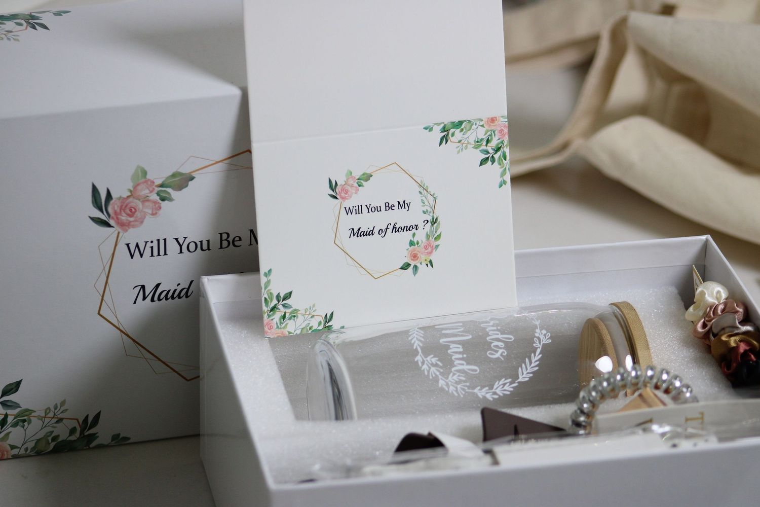 Wedding stationery items with floral designs and delicate details.
