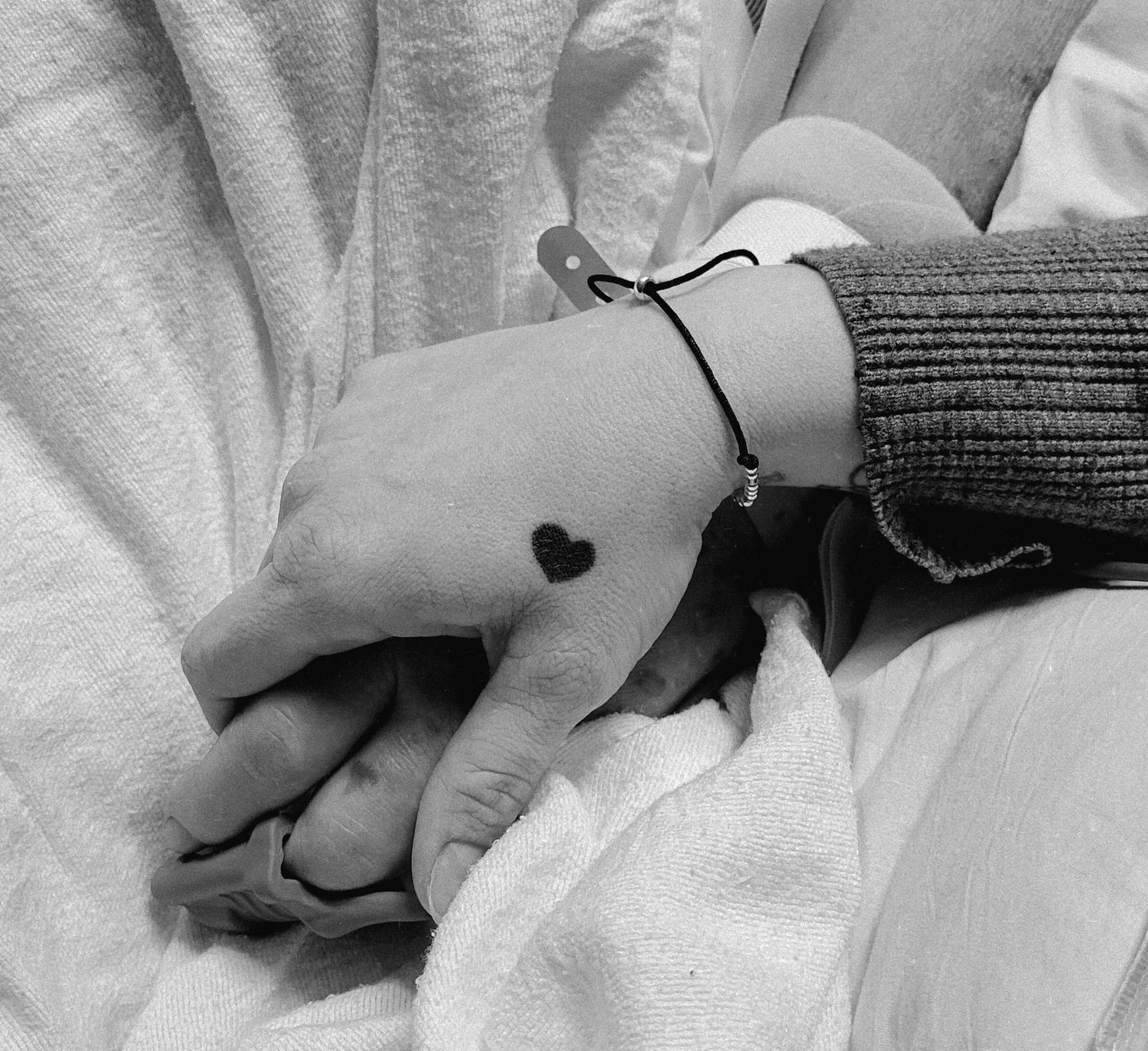 Gloucester, VA Portrait- A daughter holding the hand of her dying father.