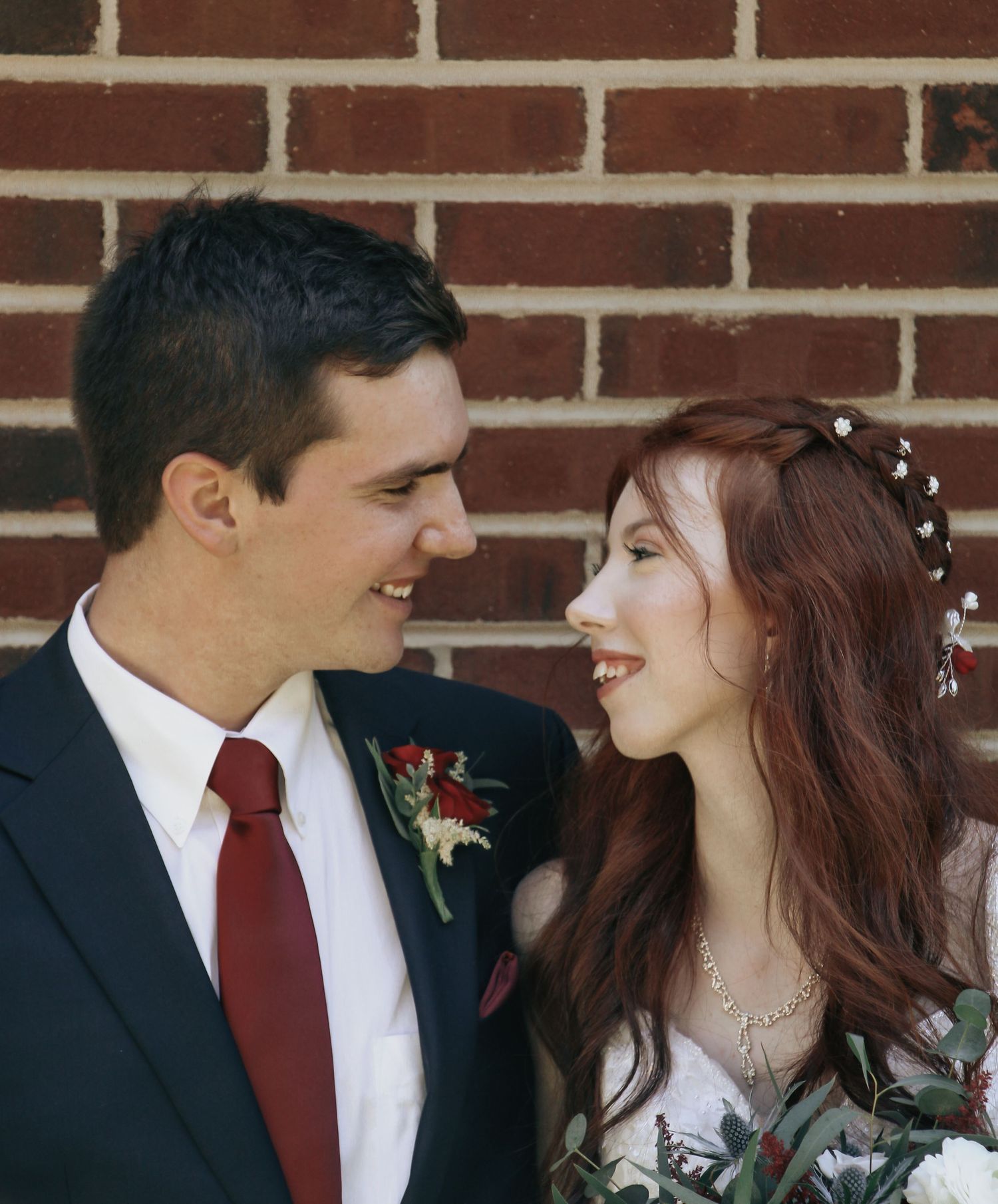 Goochland, VA Wedding- The bride and groom looking at each other smiling.