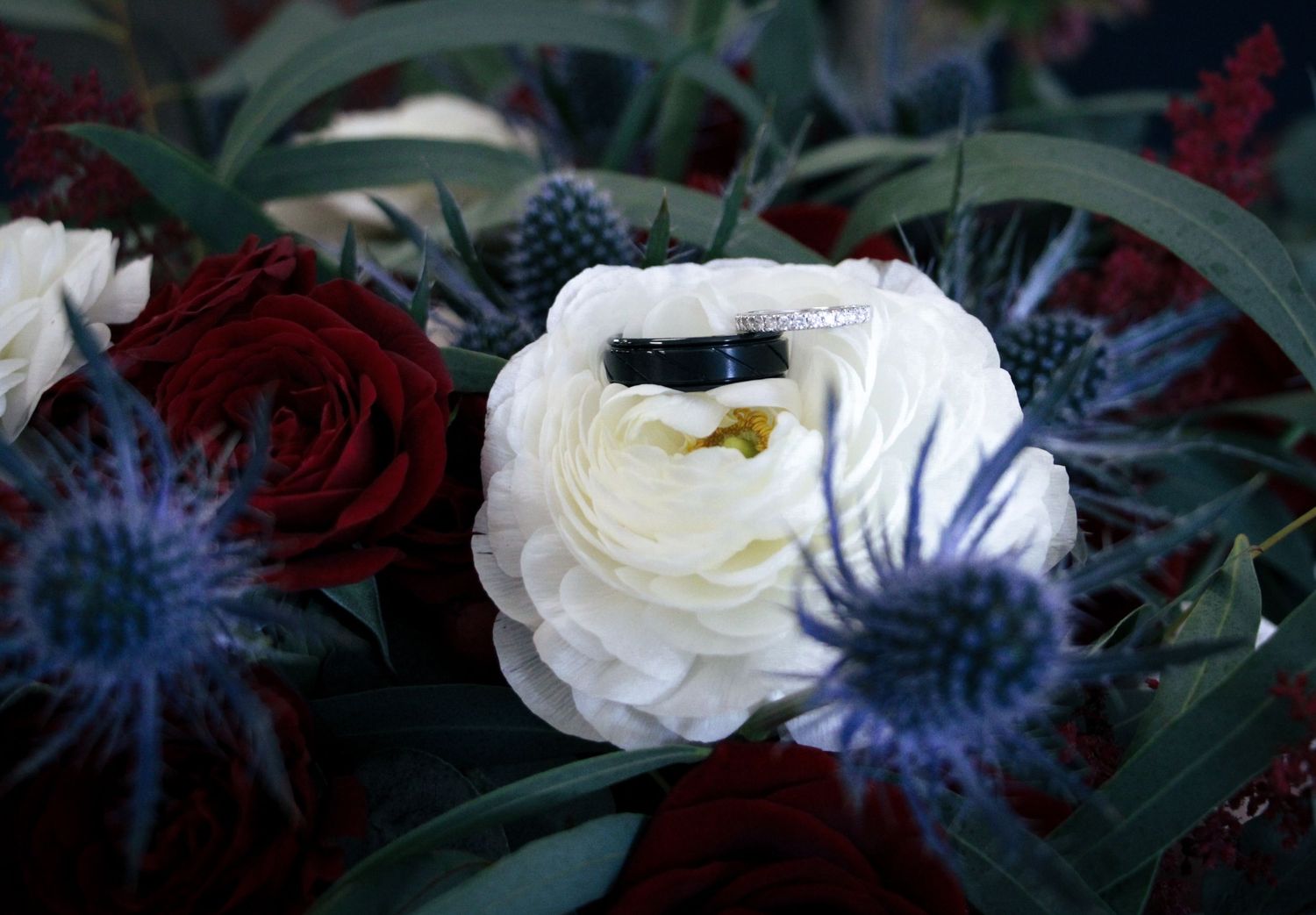 Goochland, VA wedding- His and Hers wedding bands set on top of bridal bouquet.