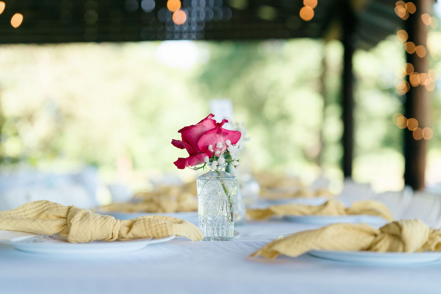 Decorative table setting with soft bokeh lights creating a romantic ambiance.