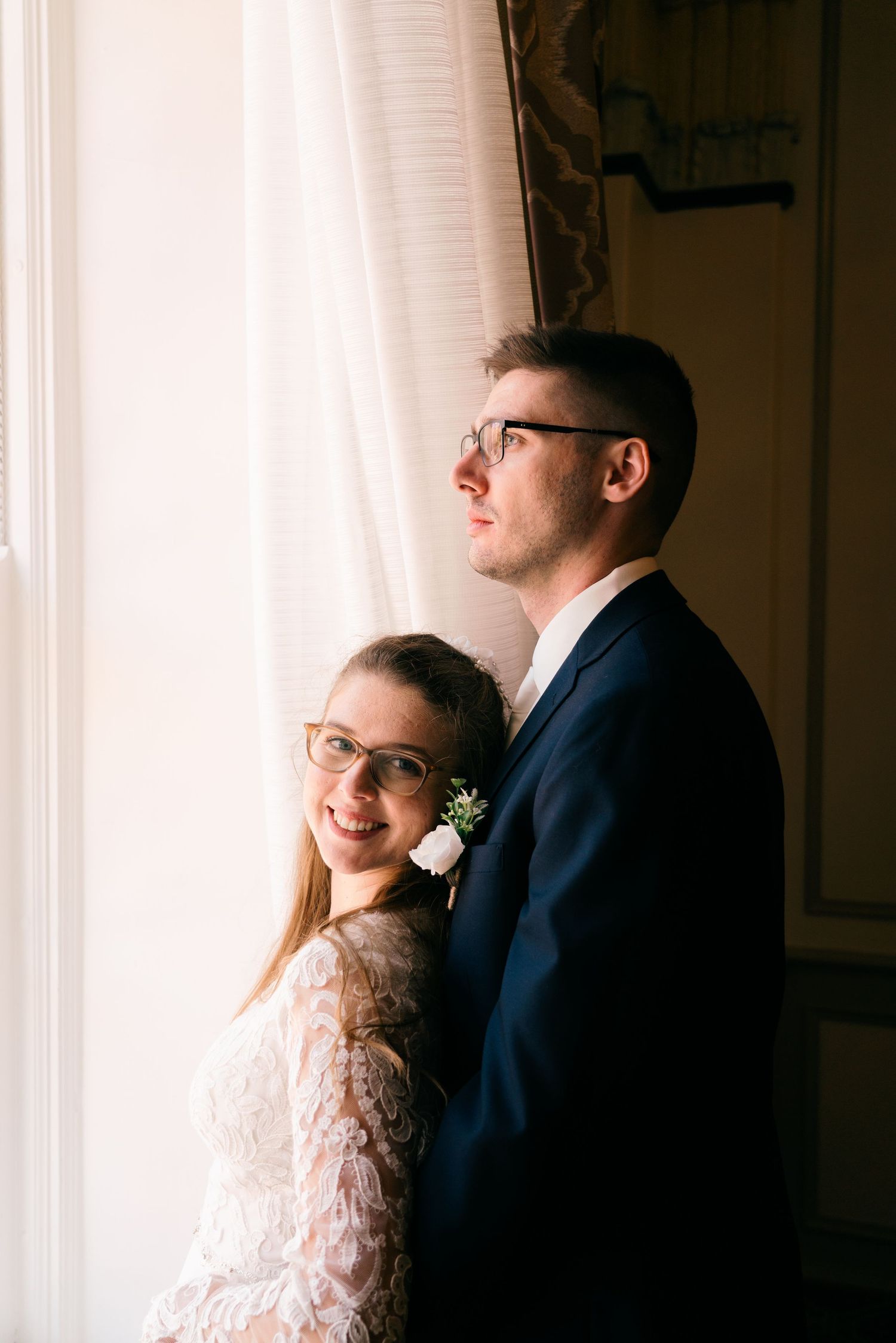 A romantic indoor portrait session with soft window lighting.