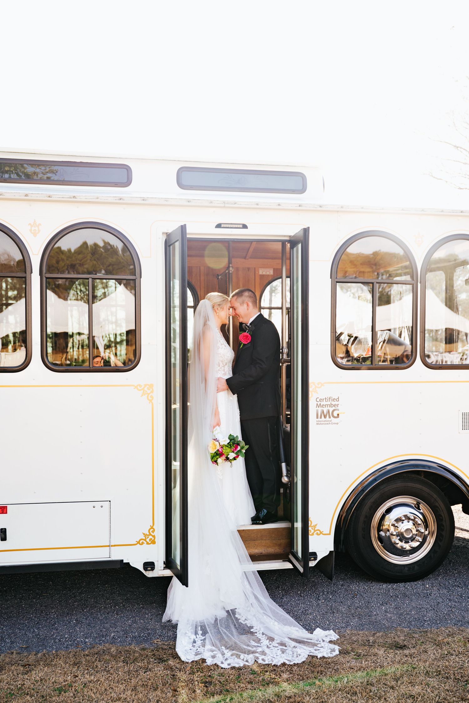 A wedding couple stands together by a white party bus in a series of romantic photo moments.
