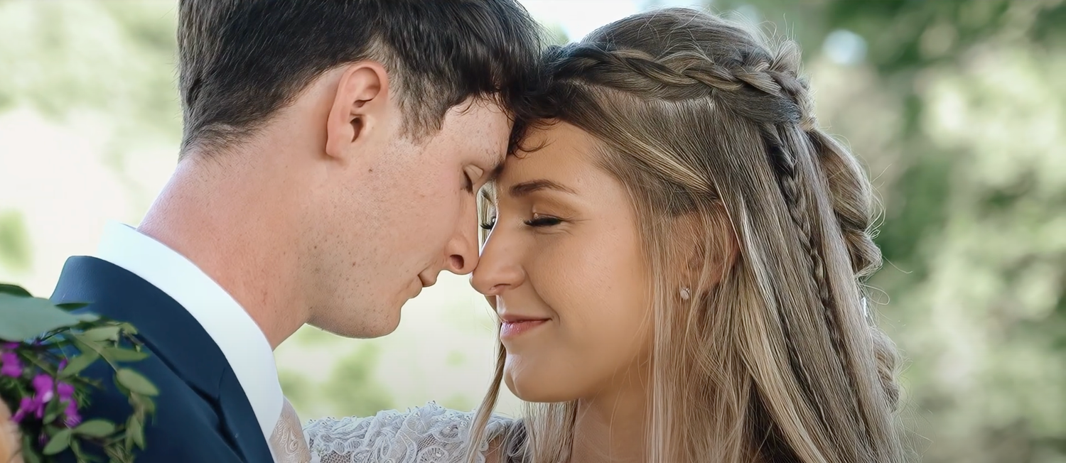 Close-up wedding portrait captured in natural outdoor lighting.