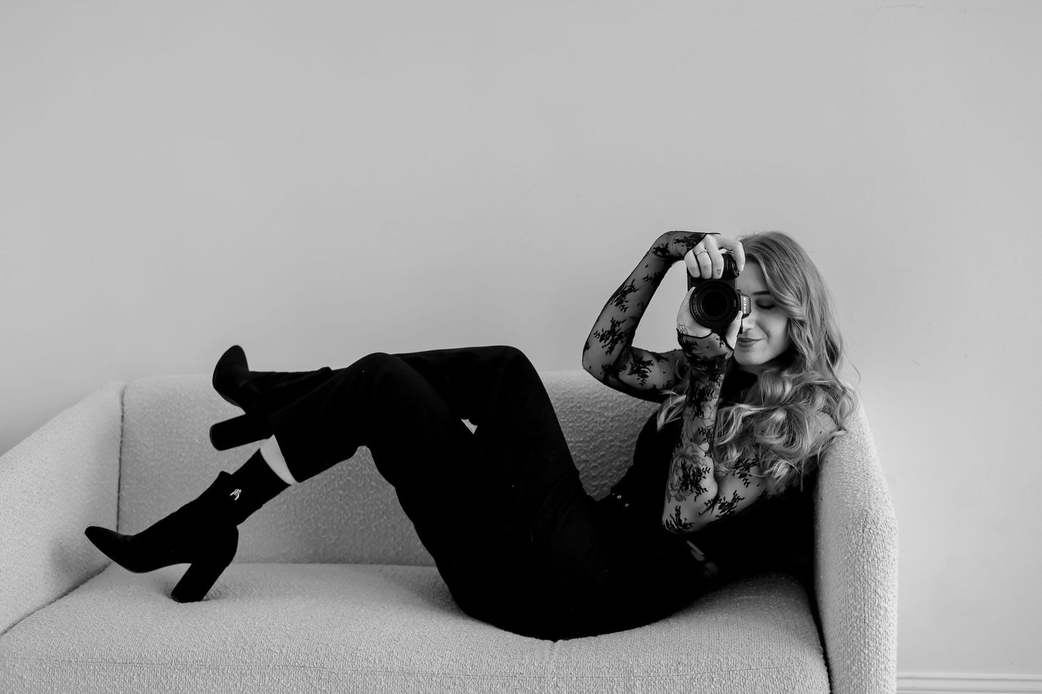 Black and white photo series showing a person lying down in various graceful poses against a light background.