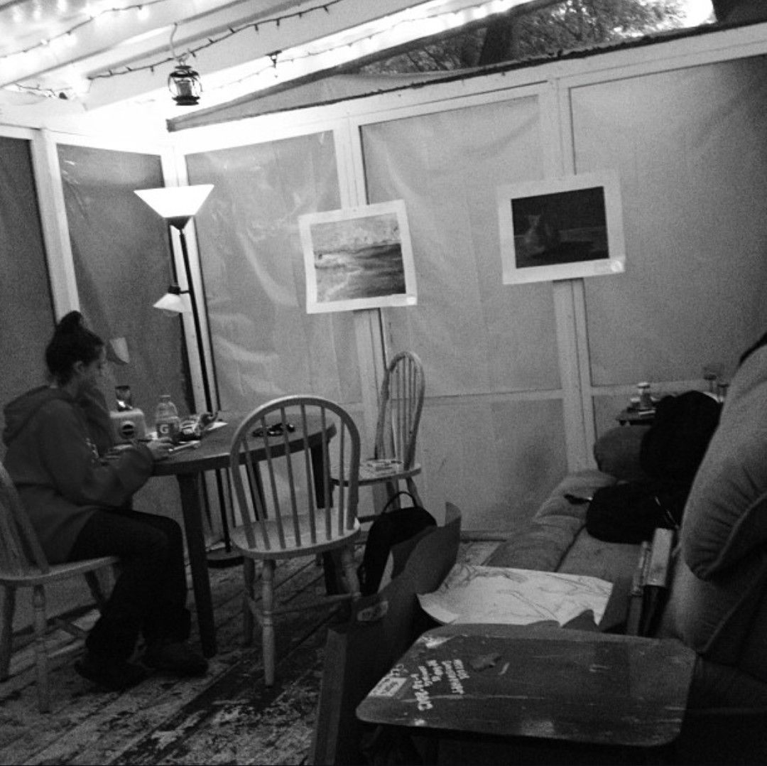 Sequence of black and white security camera footage showing movement in what appears to be a dimly lit room.