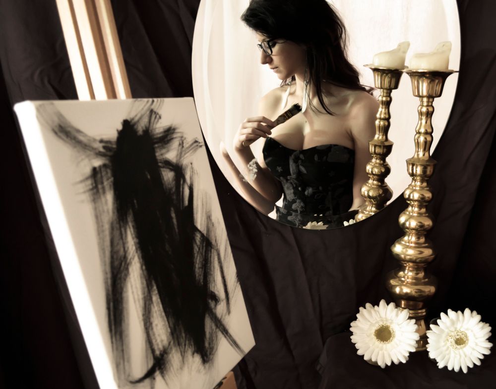 A series of black and white photos showing a person in dark clothing with brass candlesticks and white flowers.
